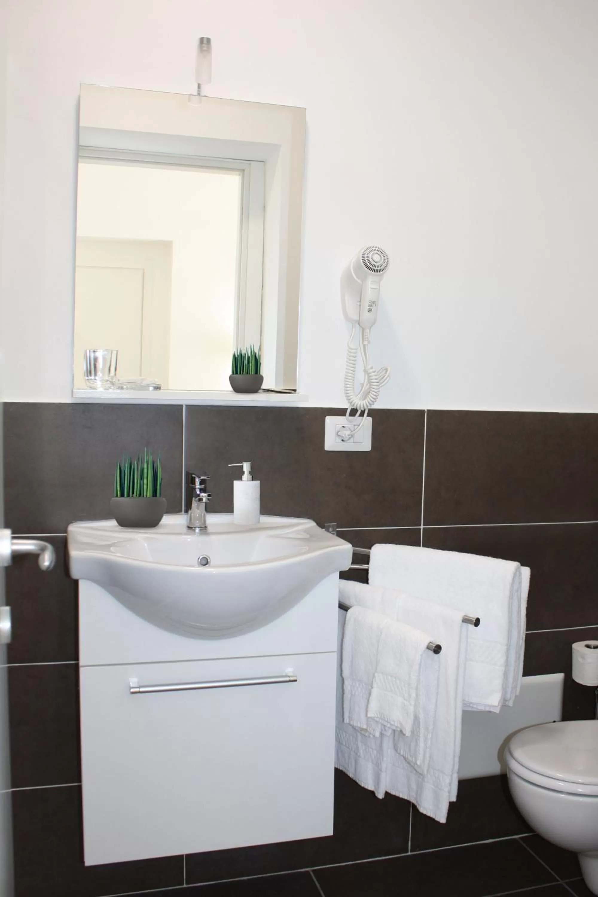 Toilet in Roma Resort Colosseum