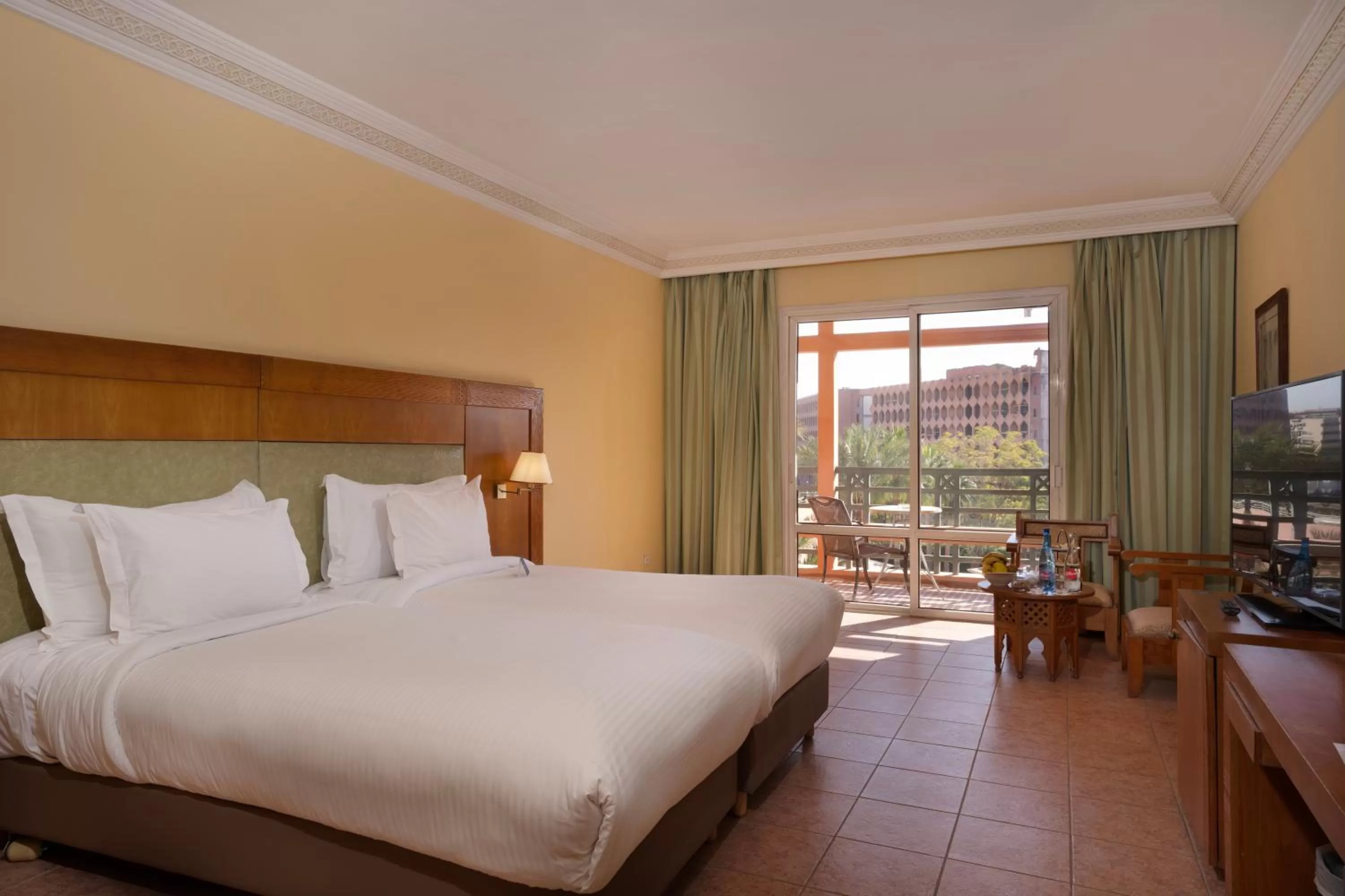 Bed in Grand Mogador Menara & Spa