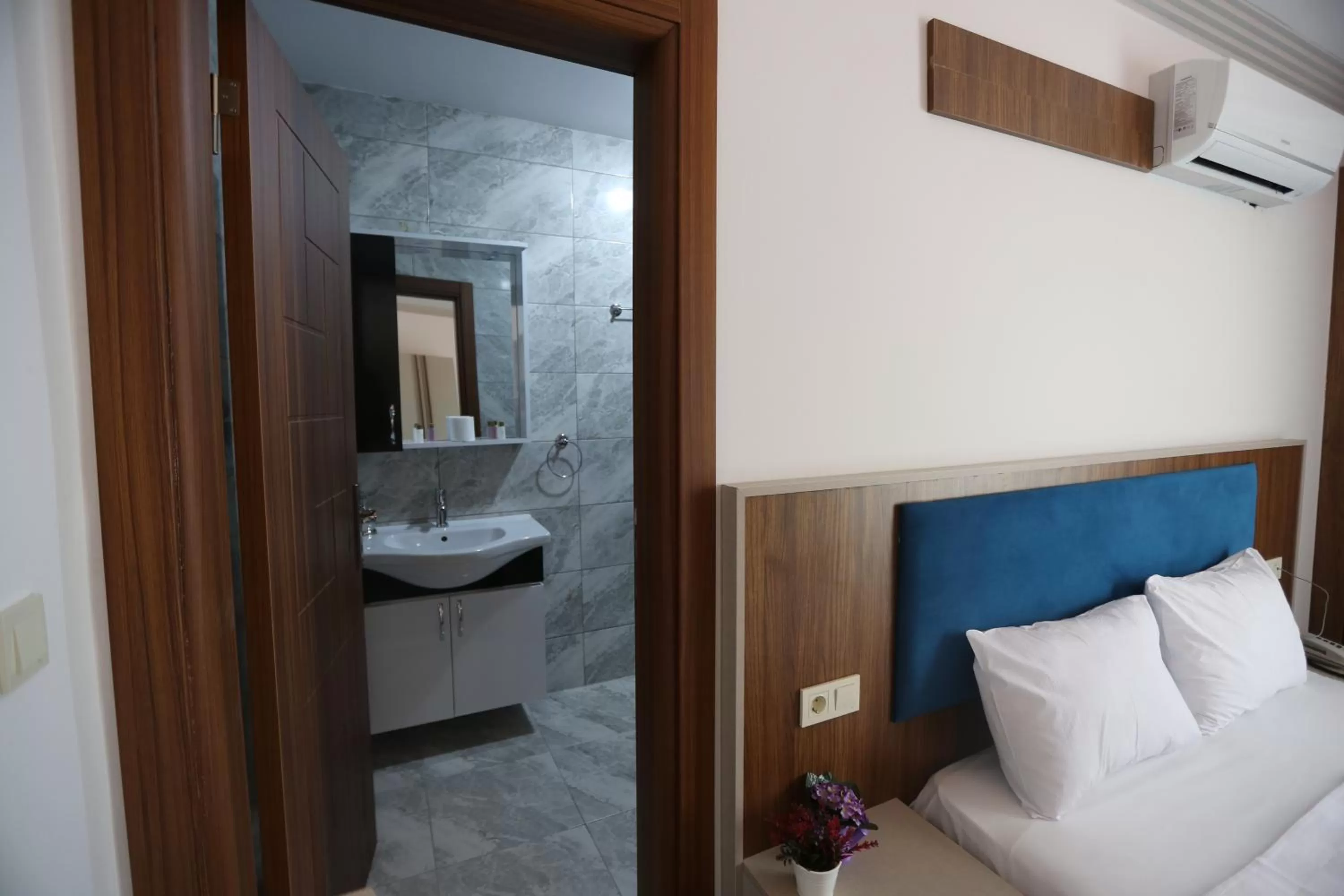 Bed in TEVETOGLU HOTEL