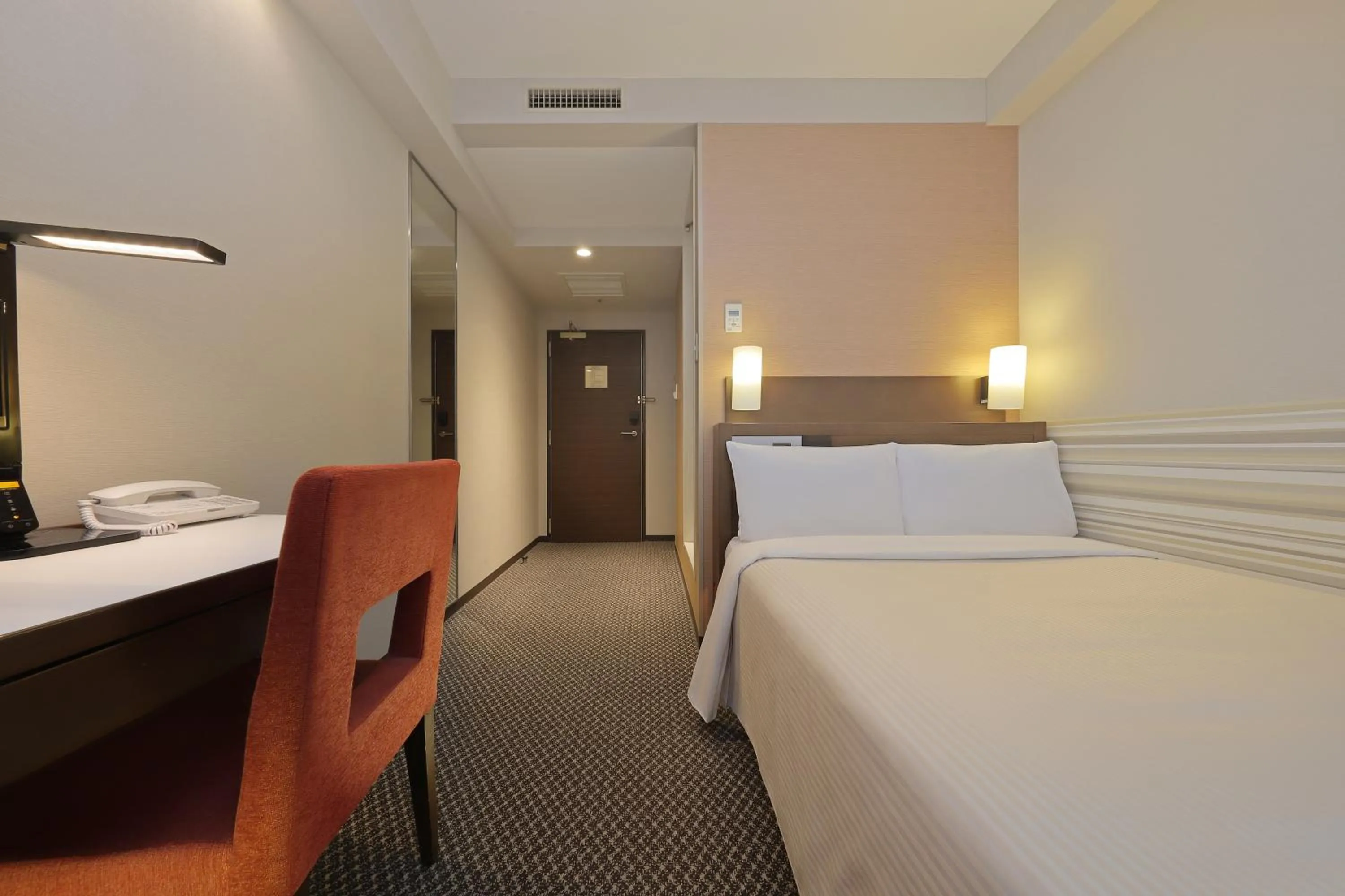 Bed in Keio Presso Inn Shinjuku