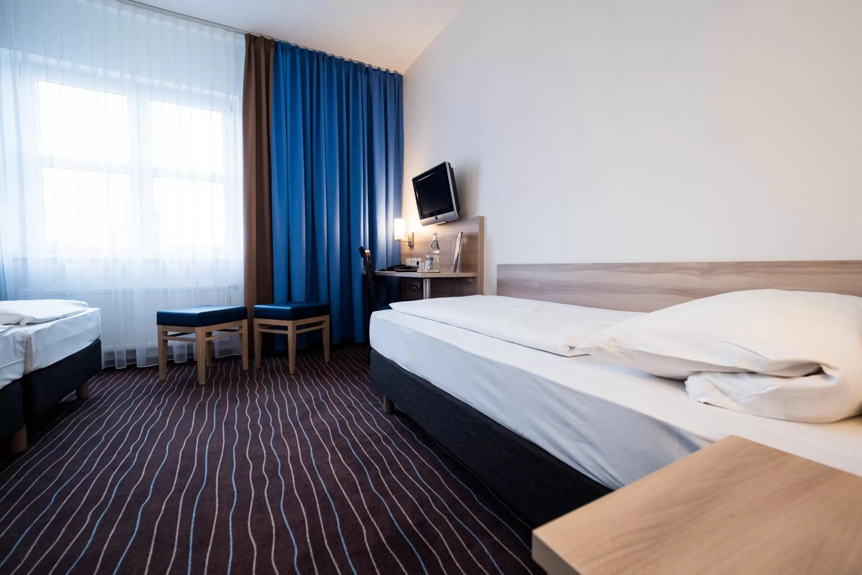 Photo of the whole room, Bed in PLAZA INN Berlin Charlottenburg