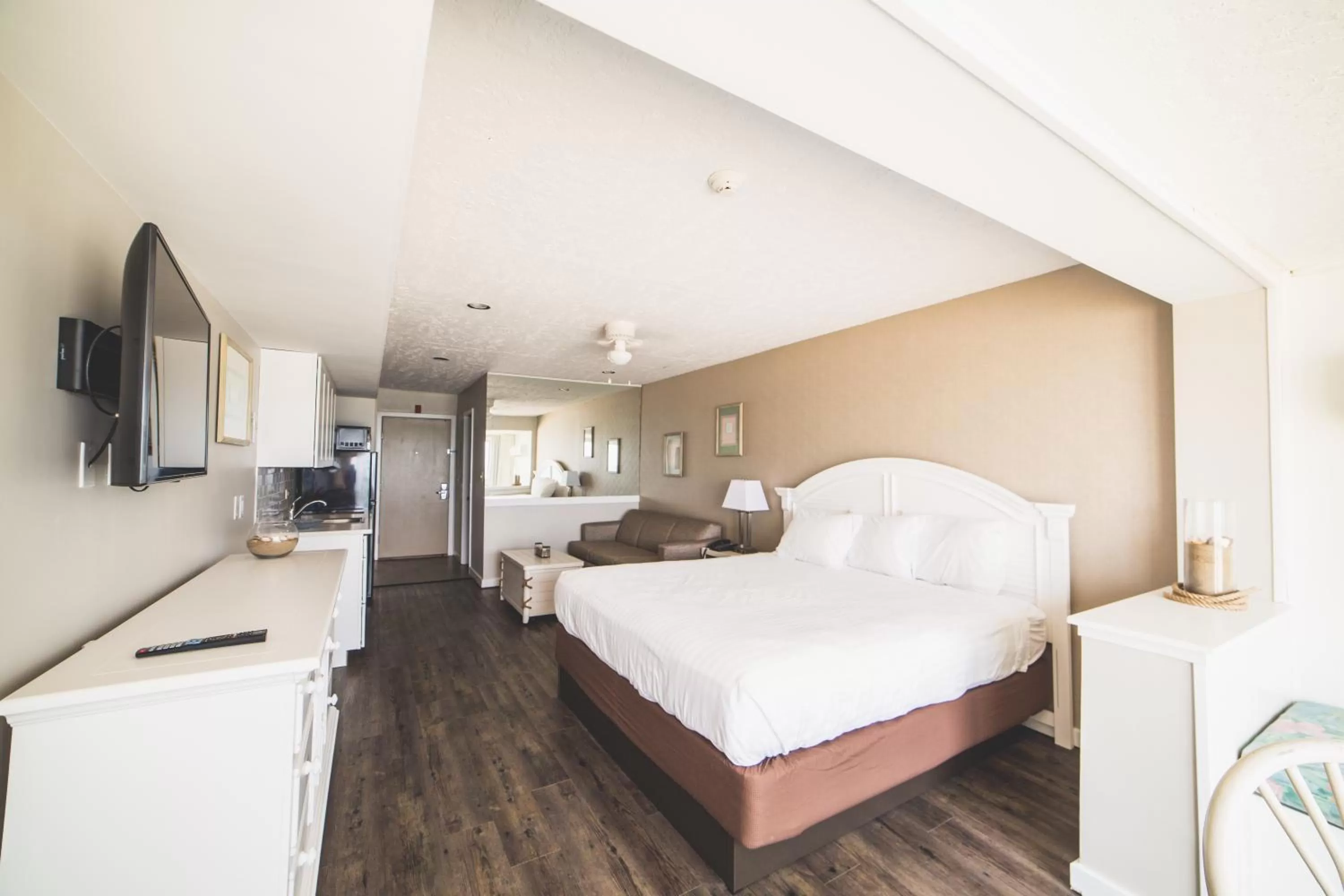 Bed in Surf Club Oceanfront Hotel