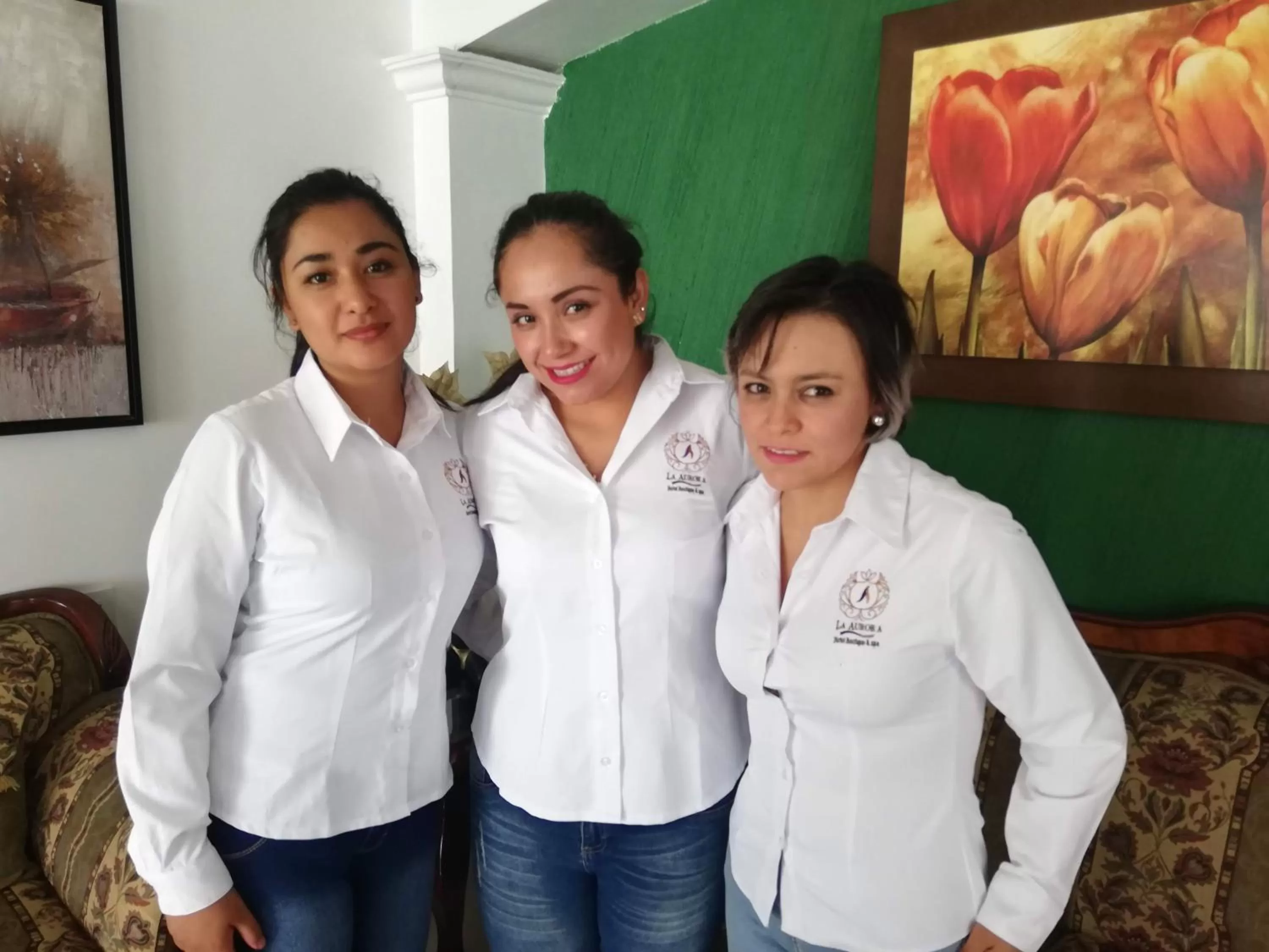 Staff in La Aurora Hotel Like Home