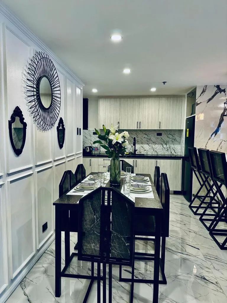 Kitchen or kitchenette, Restaurant/Places to Eat in Mpt Suites