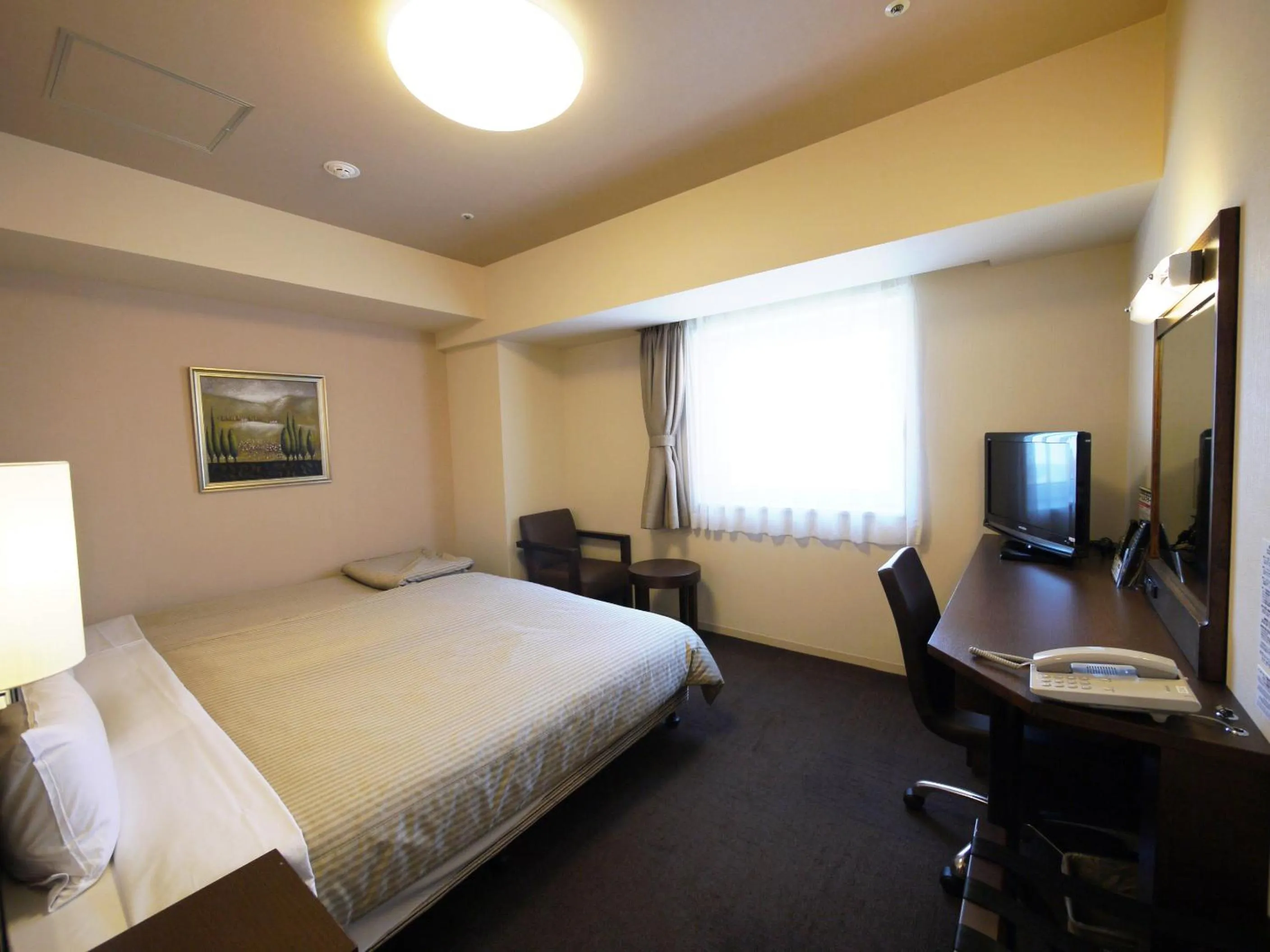 Bed in Hotel Route-Inn Sapporo Chuo