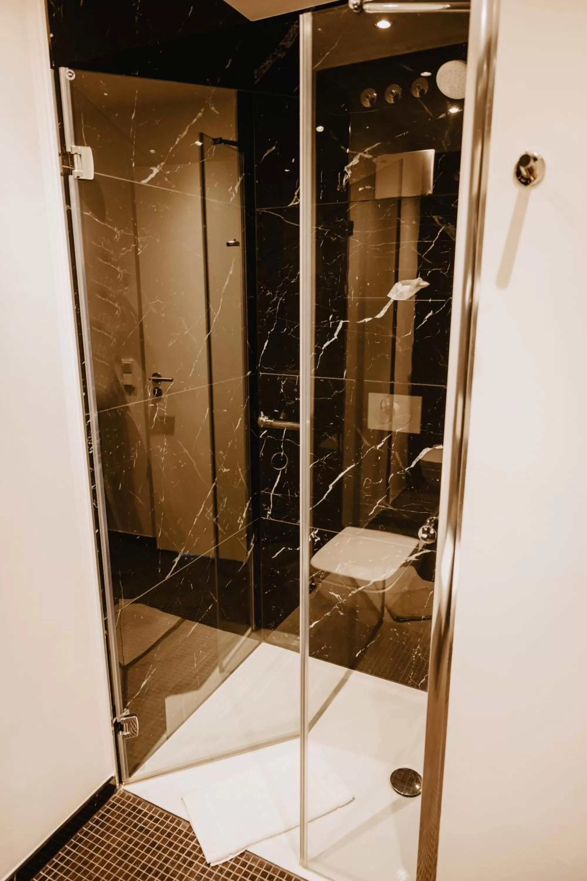 Shower in The Bridgge Grand Boutique Hotel