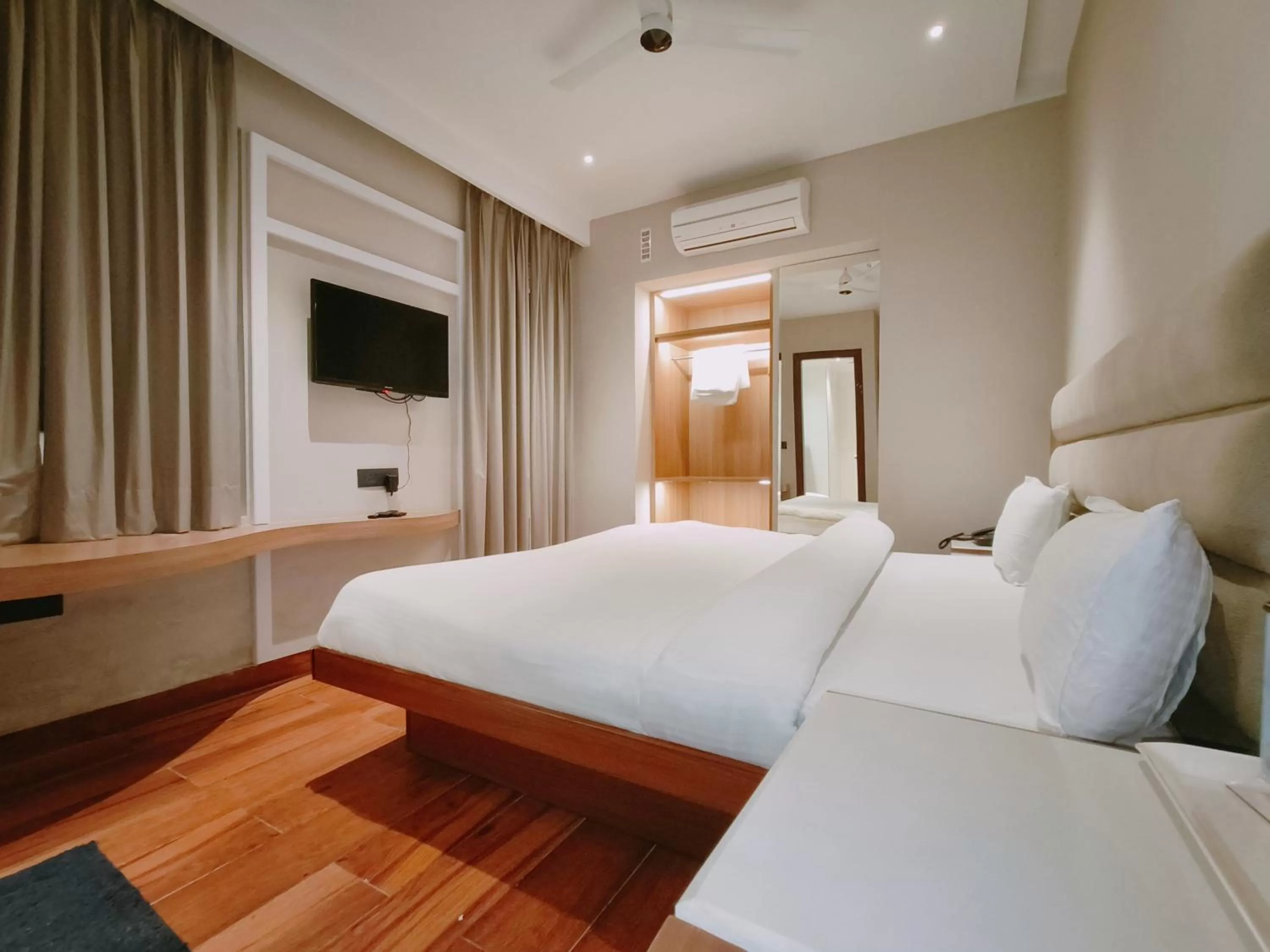 Bed in Aura Rooms