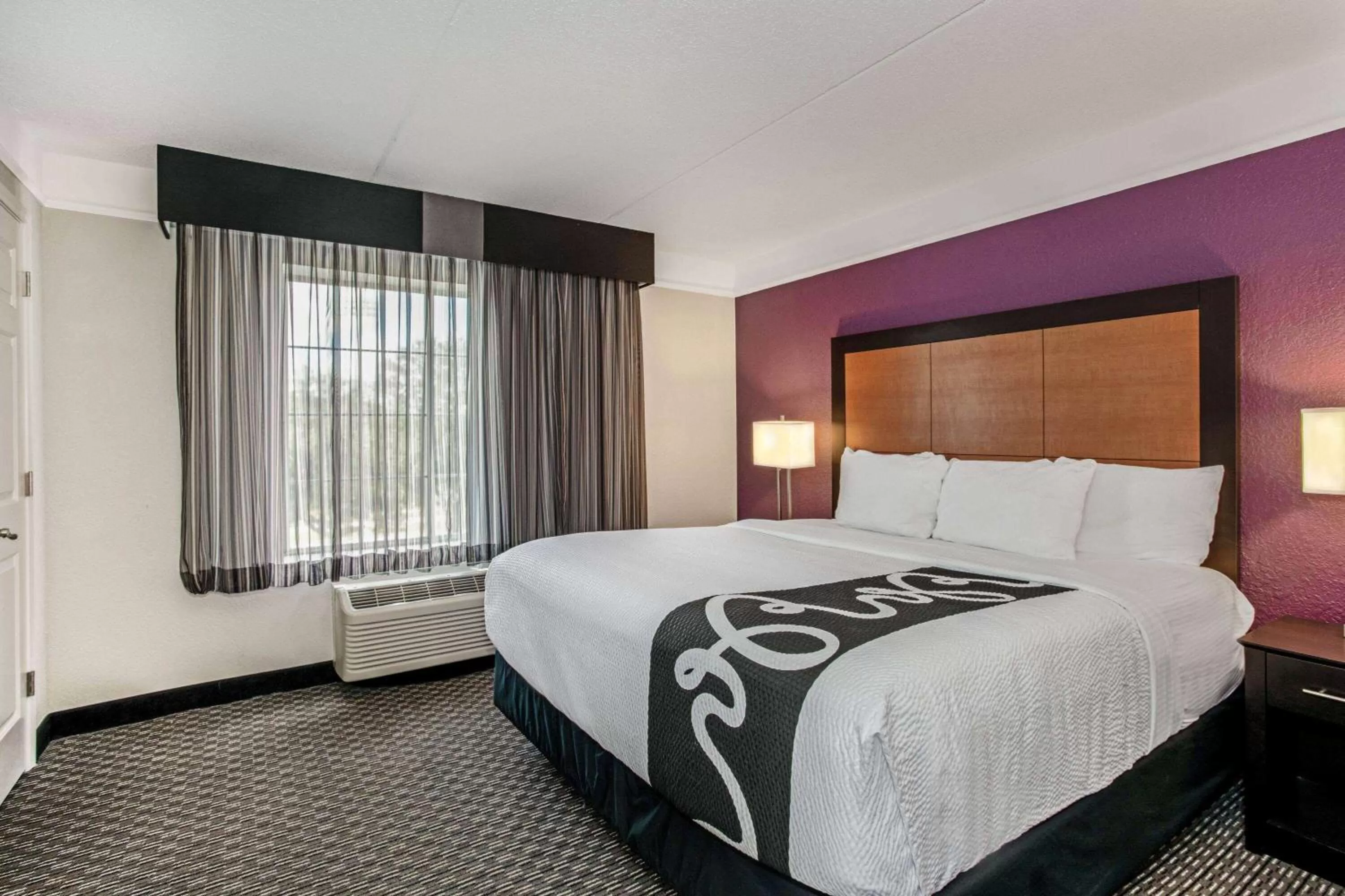 Photo of the whole room, Bed in La Quinta by Wyndham Orlando Airport North - Free Airport Shuttle!