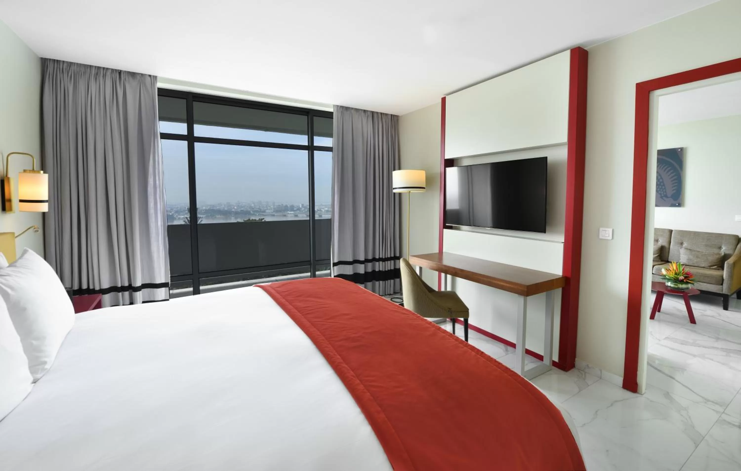Communal lounge/ TV room, Bed in Sofitel Abidjan Hotel Ivoire