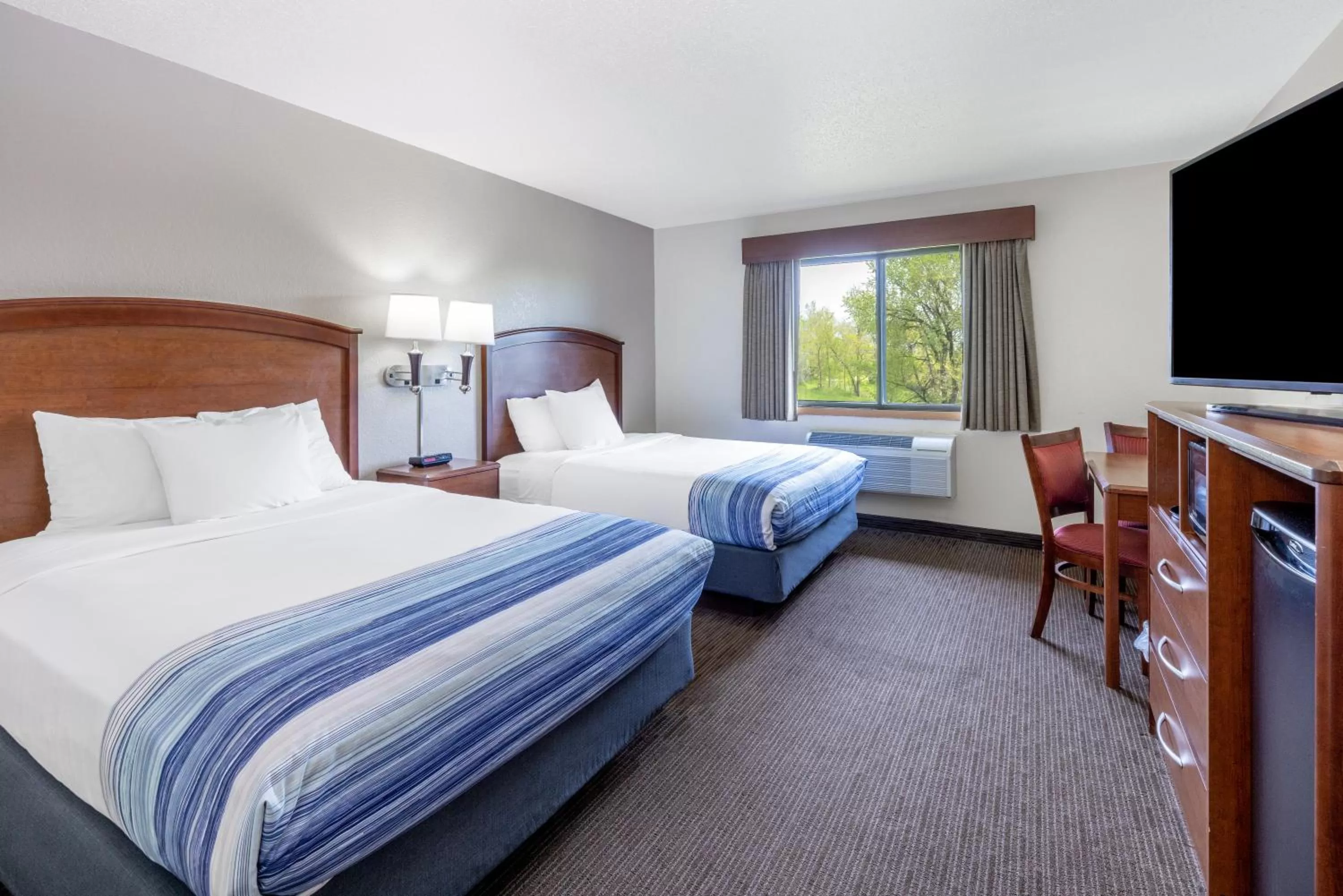 Photo of the whole room, Bed in AmericInn by Wyndham Dickinson