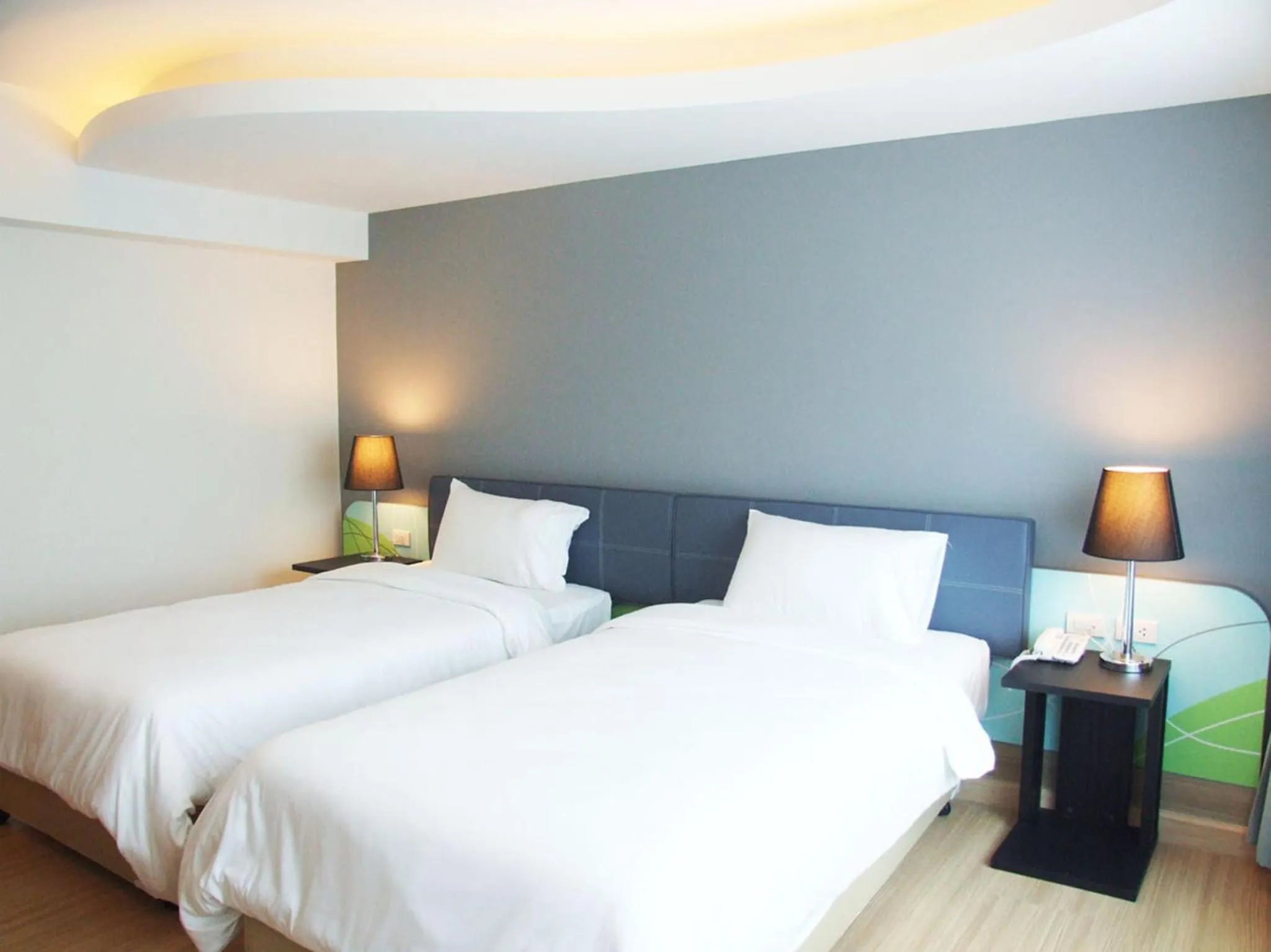 Bed in Grand Tower Inn Sathorn Hotel