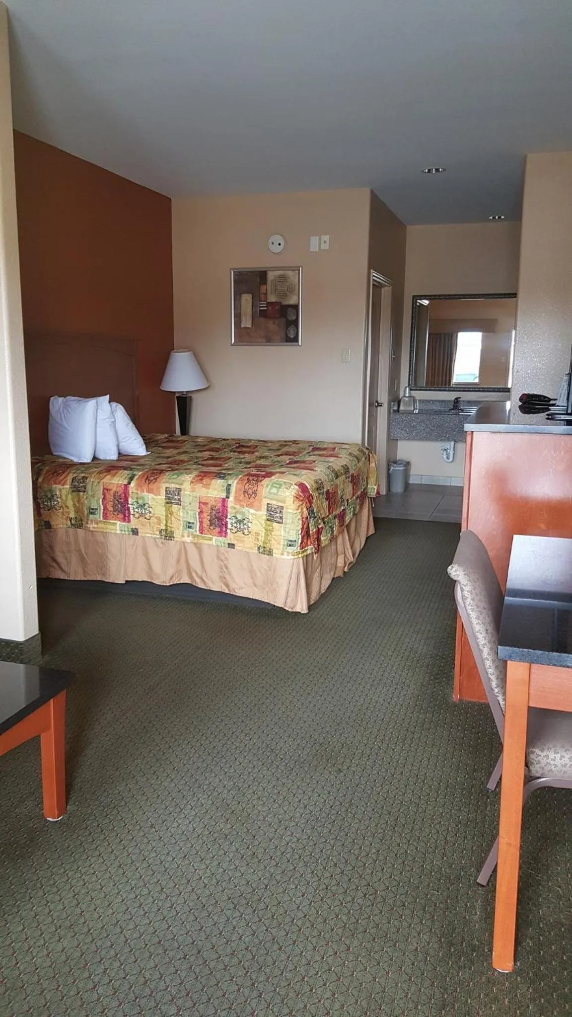 Bed in Budgetel Inn and Suites
