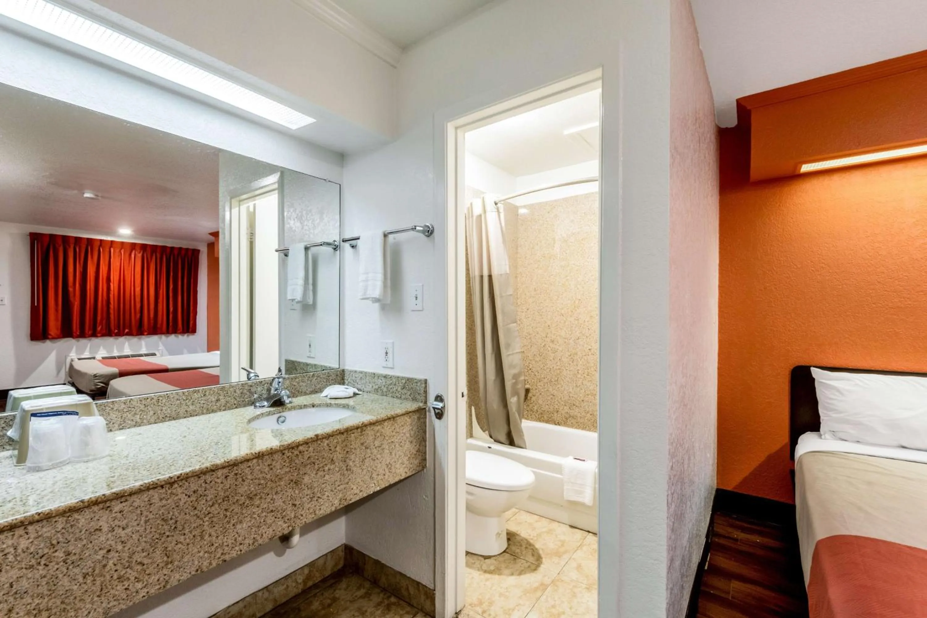 Toilet, Bed in Motel 6 San Antonio, TX - Frost Bank Center