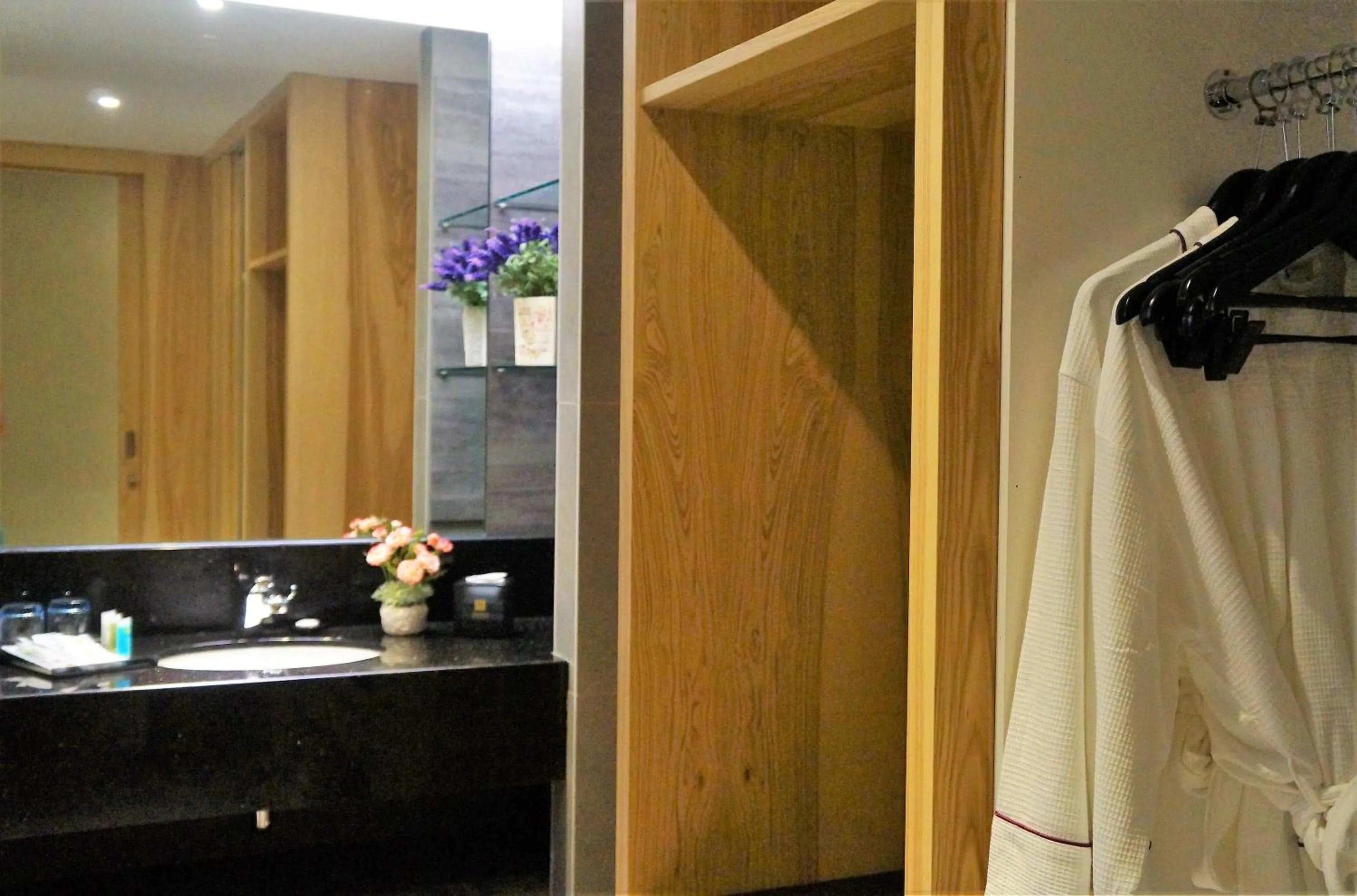 Bed in Greens Hotel & Suites