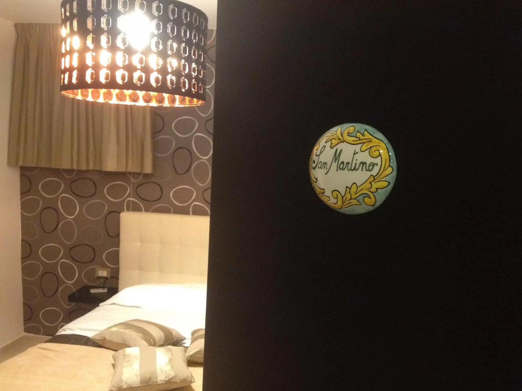 Decorative detail, Bed in Terrazza Partenopea