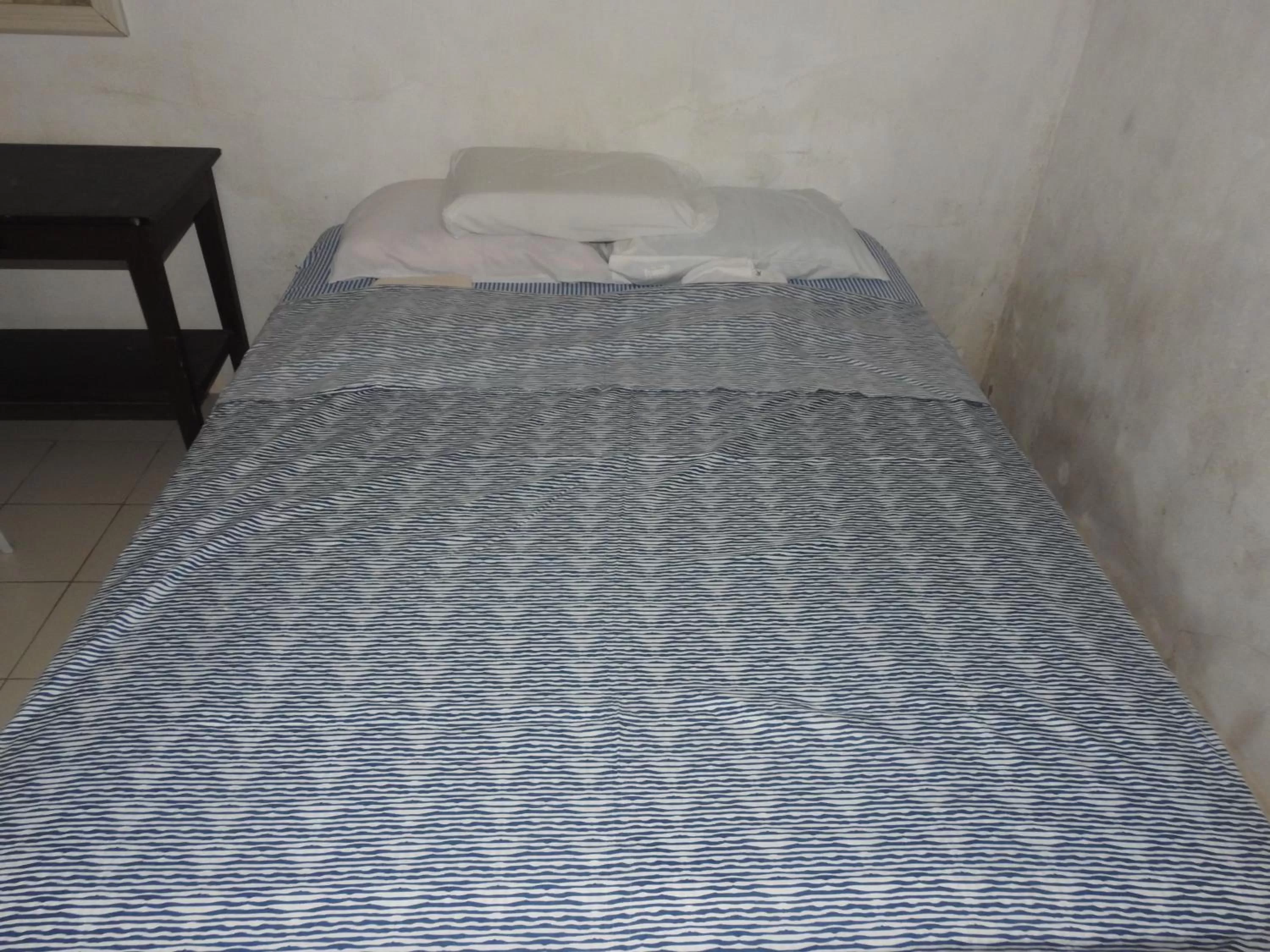 Bed in Pacifico Seaside Lodge