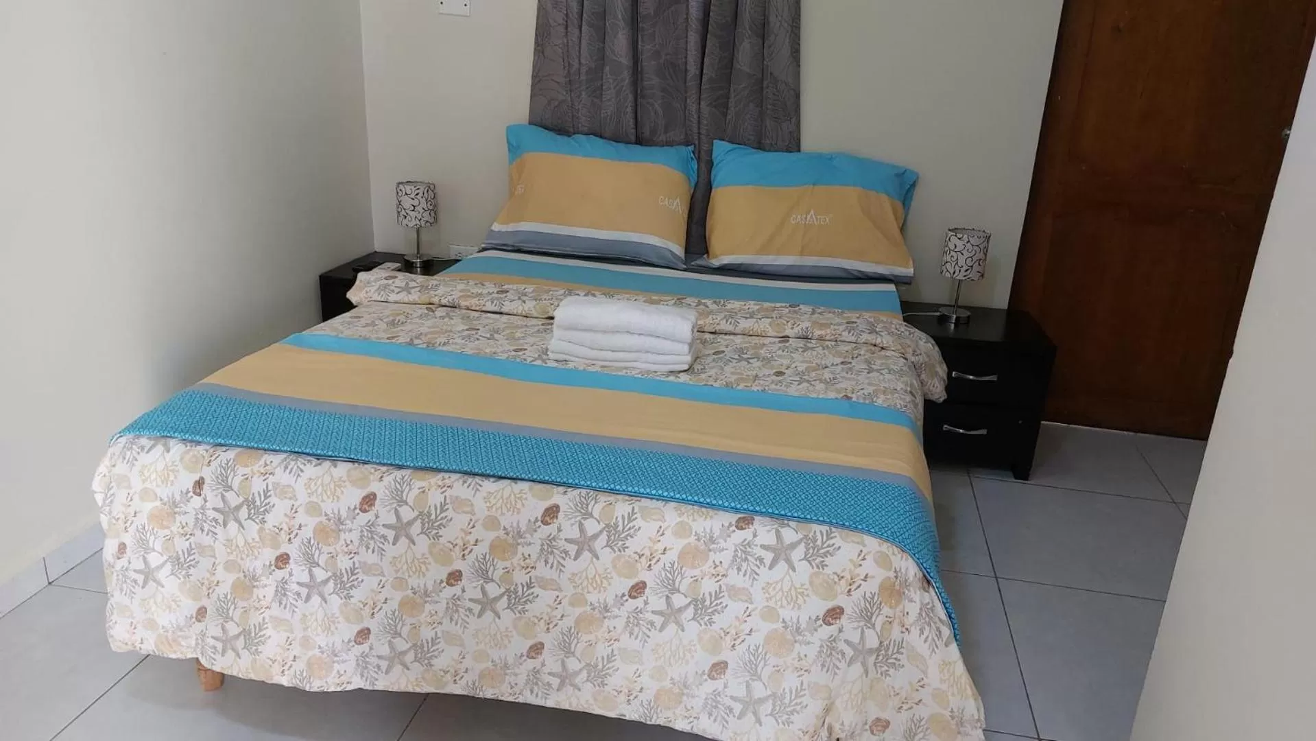 Bed in Curasita colour Appartments