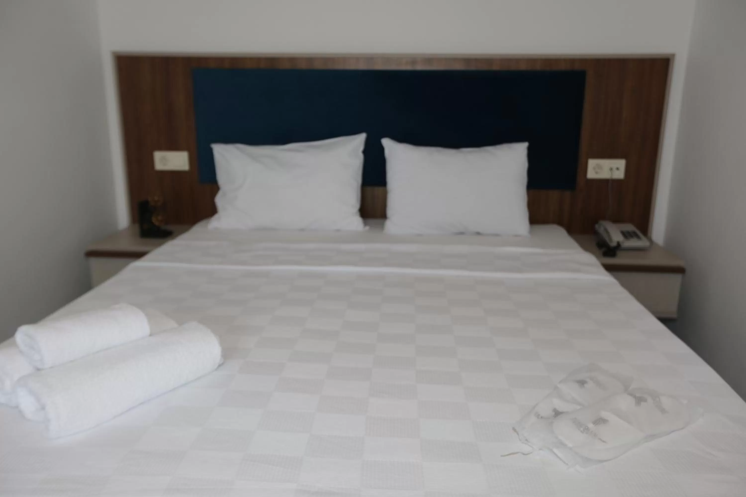 Bed in TEVETOGLU HOTEL