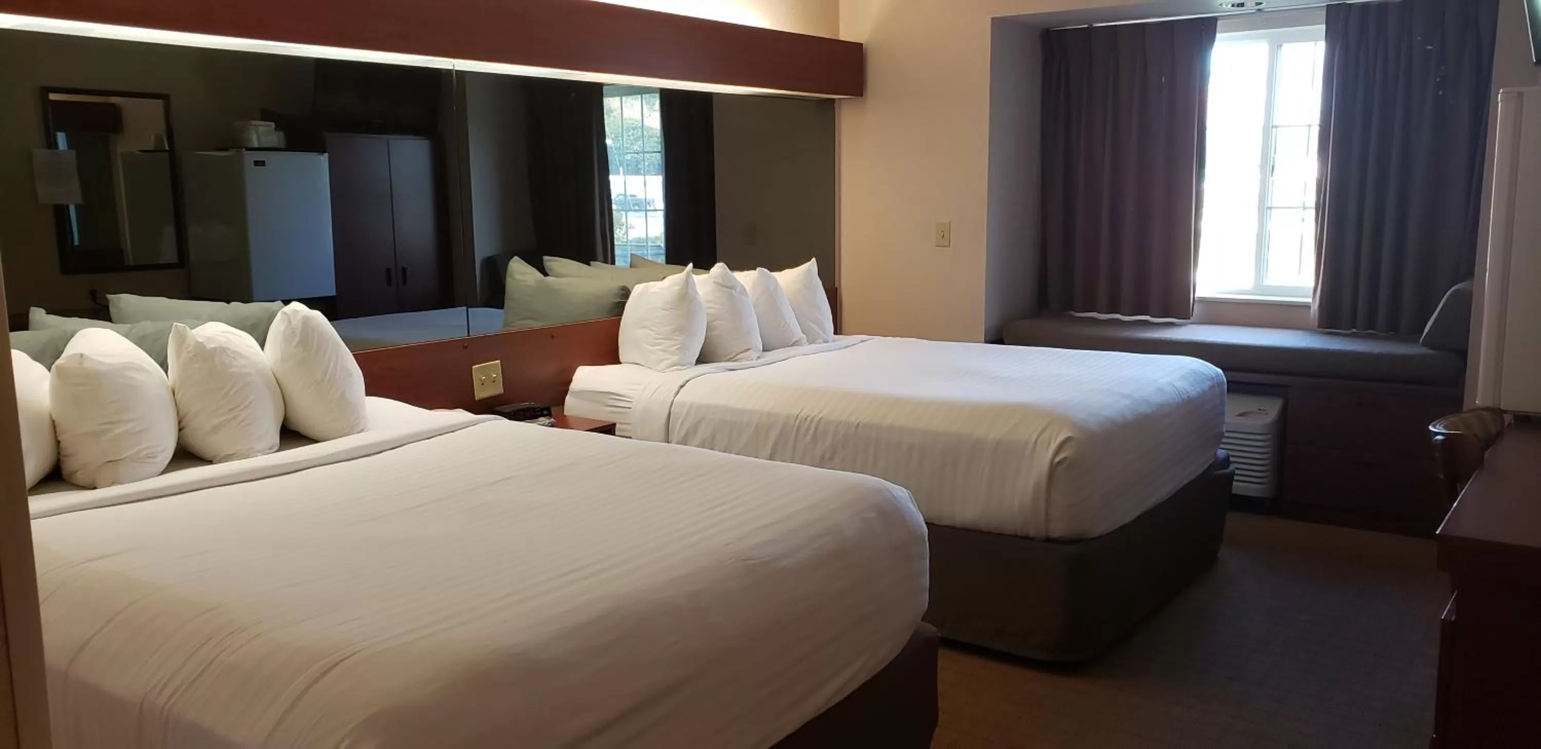 Bed in Microtel Inn & Suites by Wyndham Wellsville