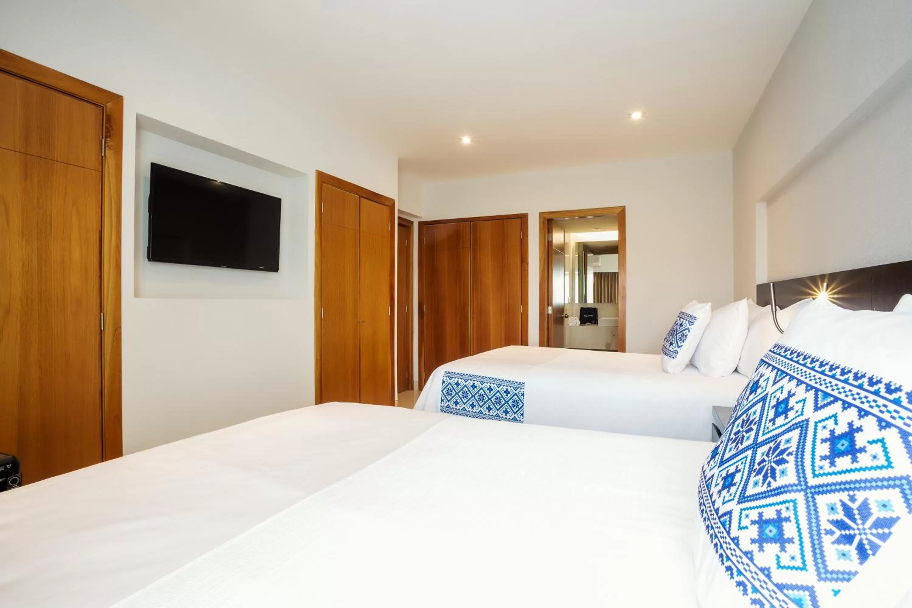 Bed in Hotel Indigo Guadalajara Expo by IHG