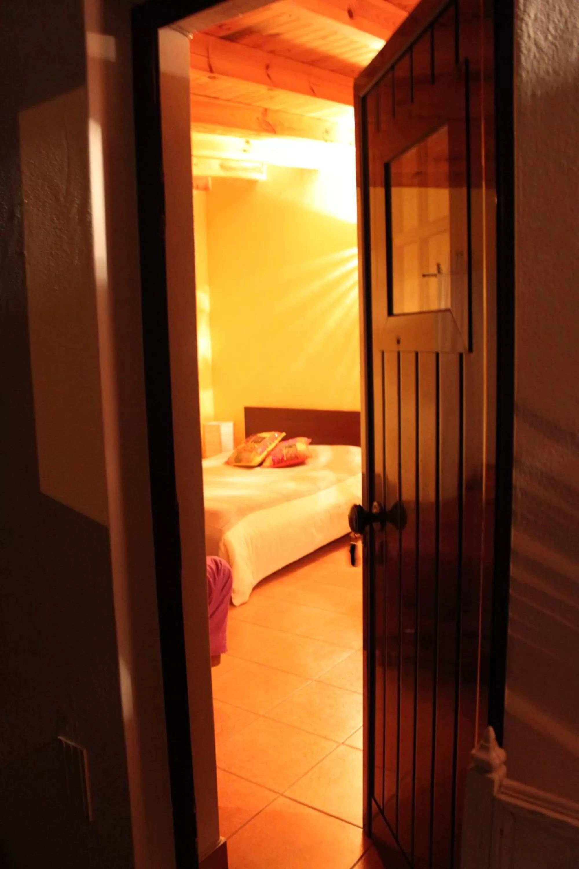 Bed in PuraVida Divehouse