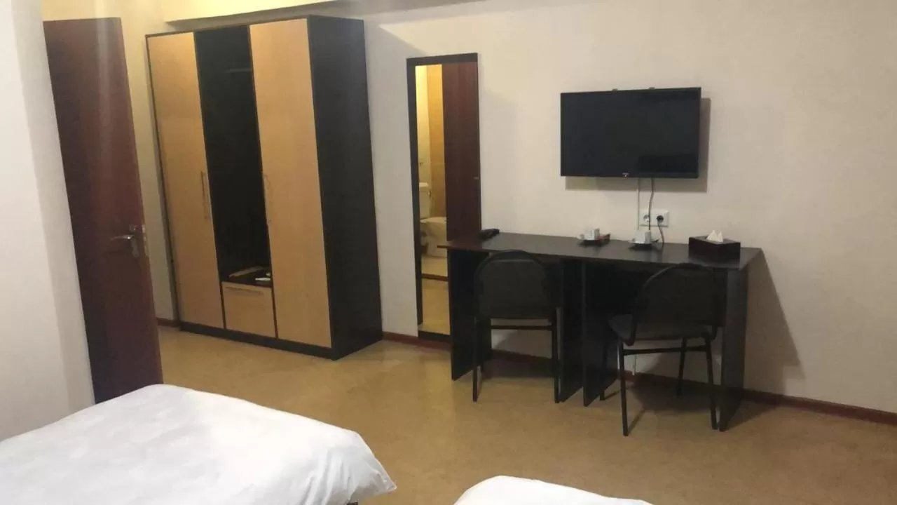 Bed in Altai Business Hotel