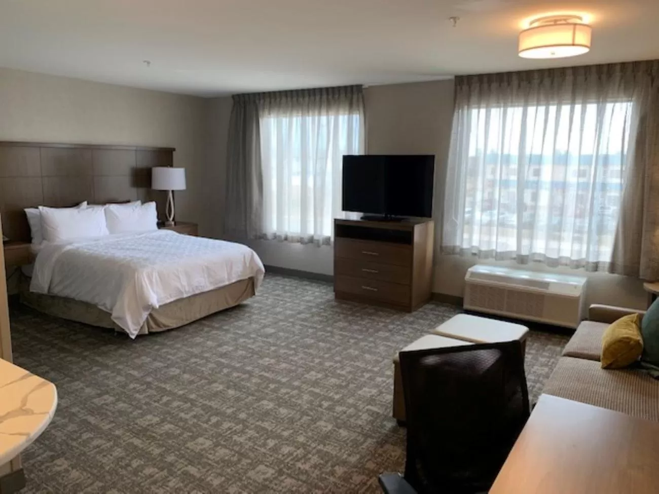 Living room, Bed in Staybridge Suites - Red Deer North by IHG