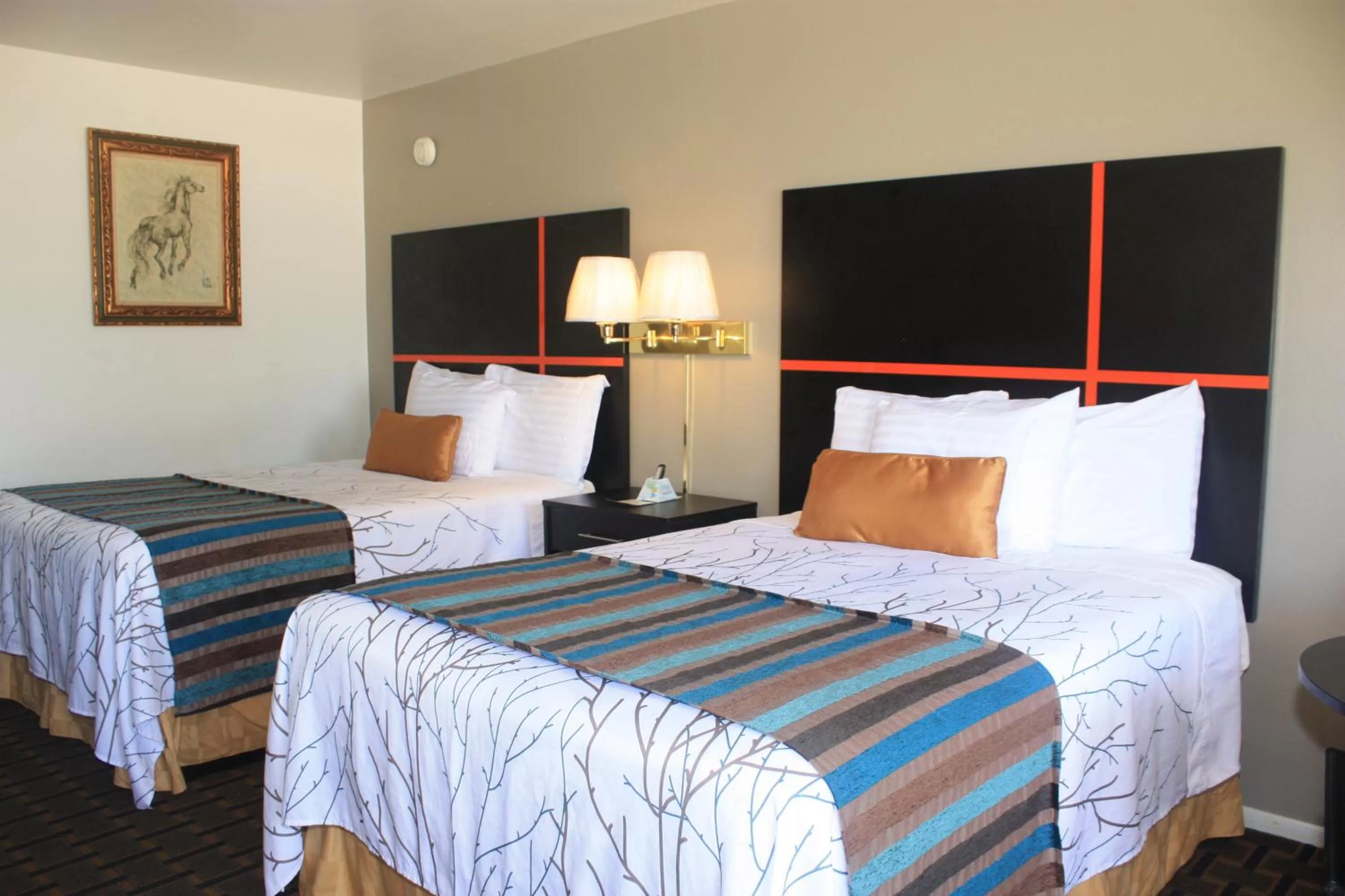 Bed in Chaparral Motor Inn