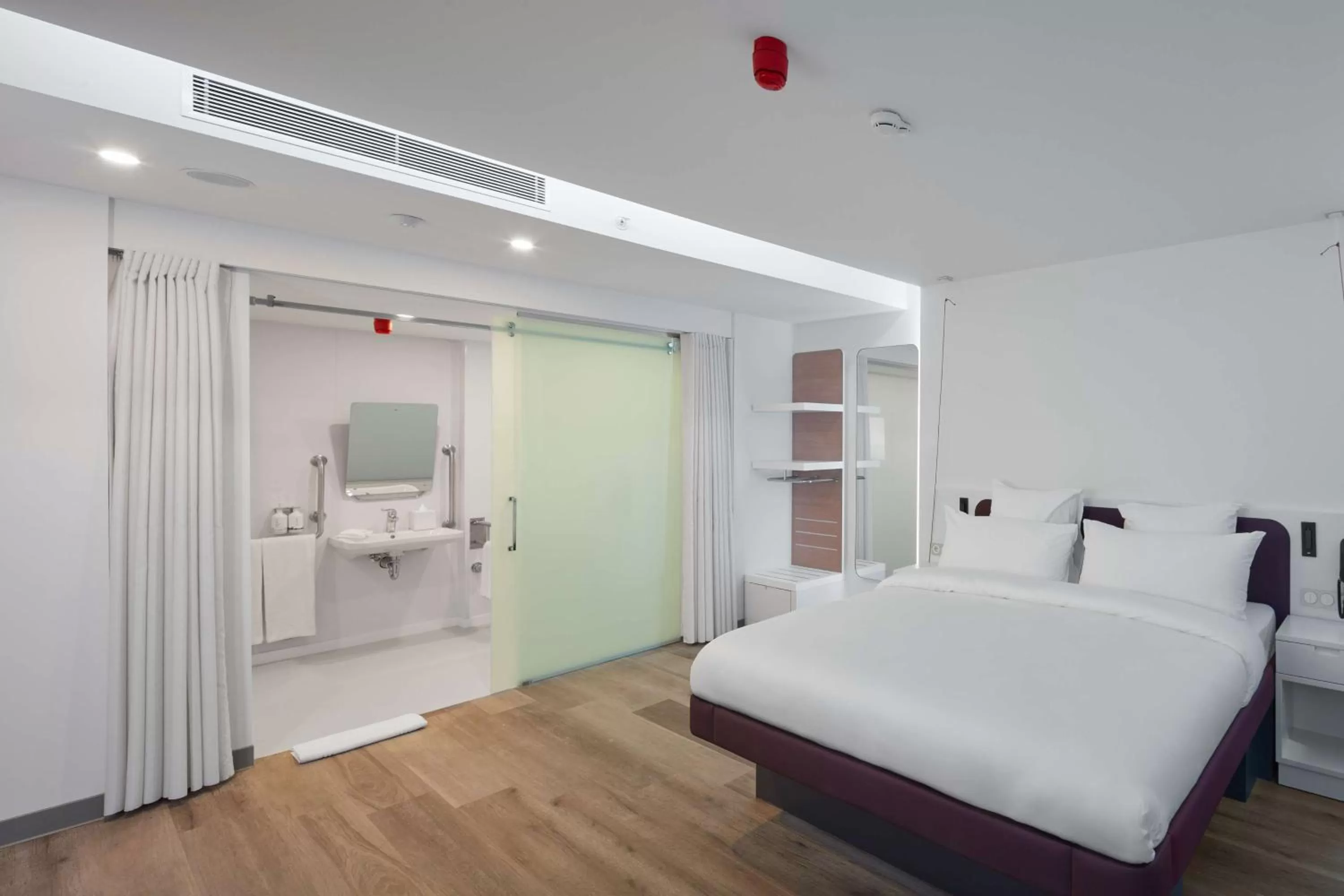 Bathroom, Bed in YOTELAIR Istanbul Airport, Duty free - International Transit area