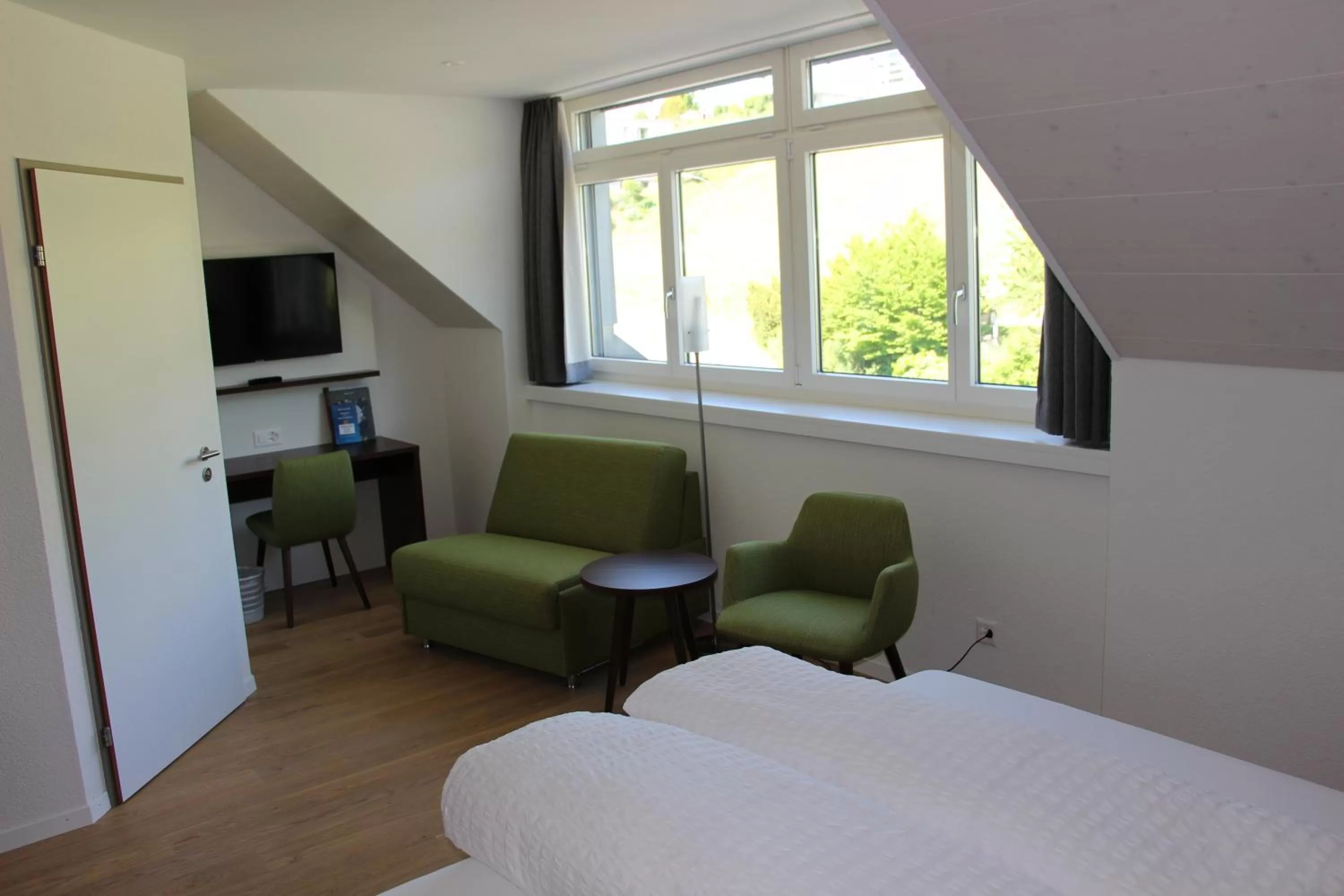 Seating area, Bed in Seehotel Delphin