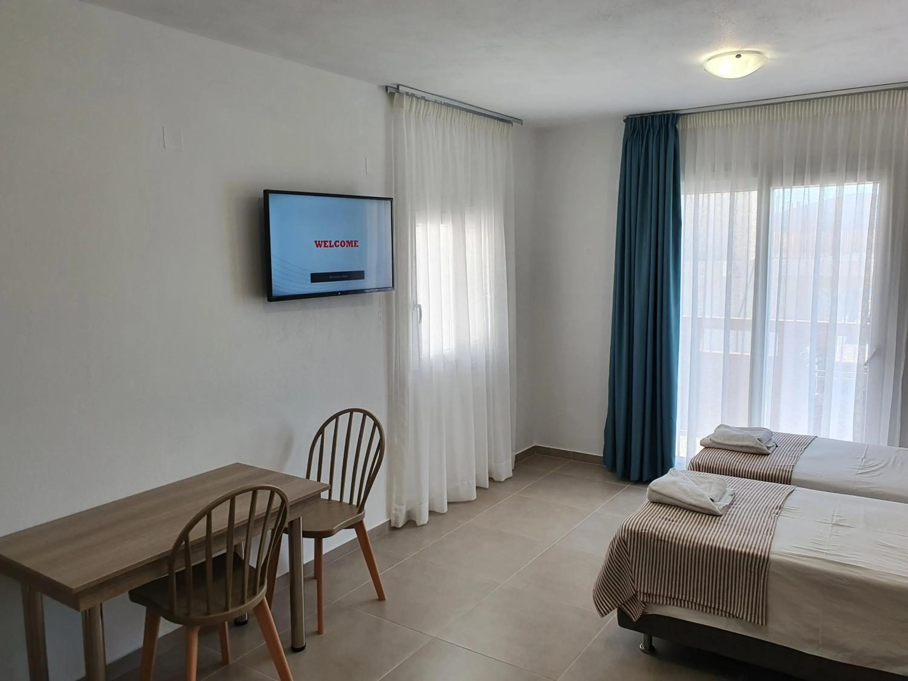 Bed in Elounda Sunrise Apartments