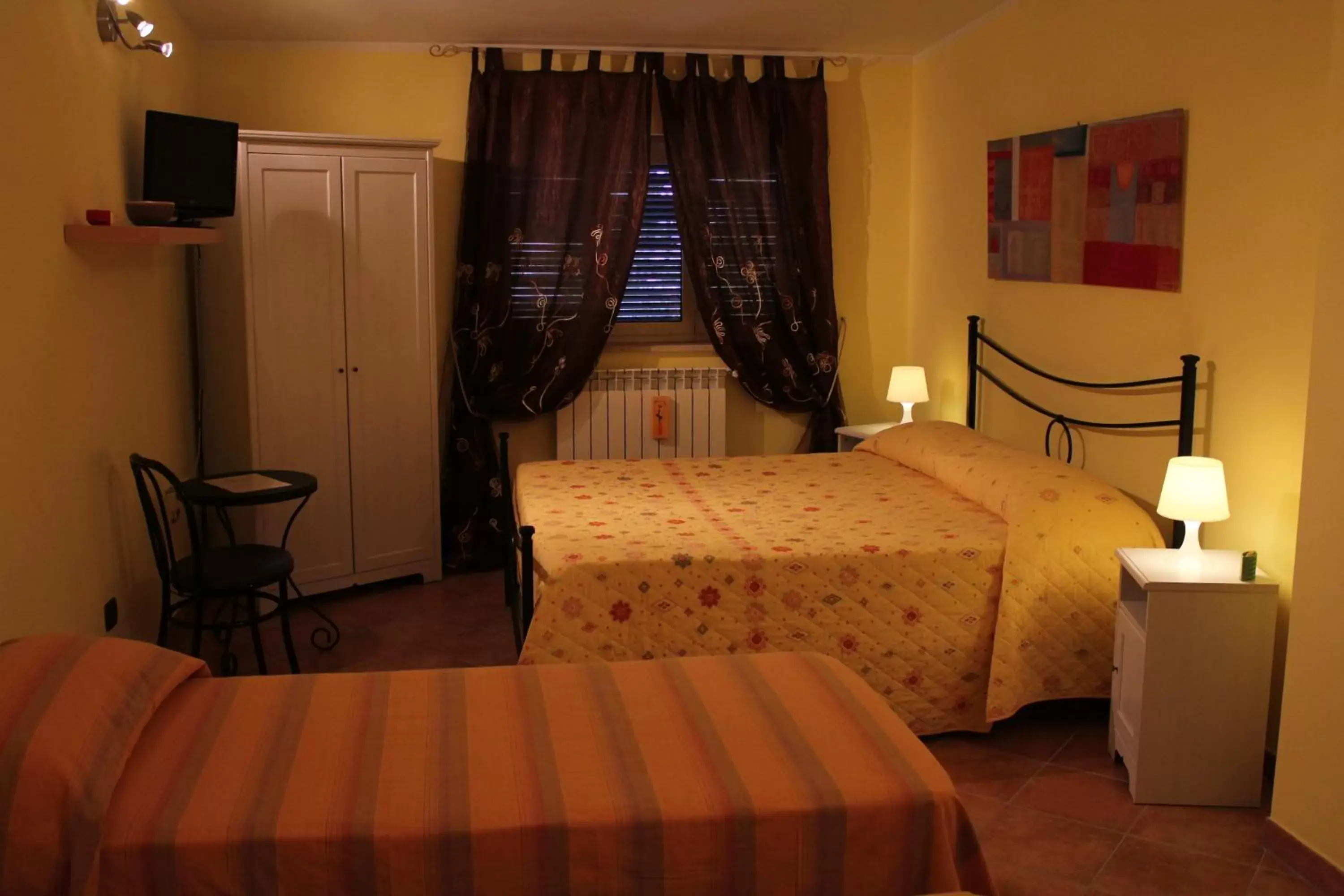 Quadruple Room - single occupancy in Il sottosopra Quadruple Room - single occupancy in Il sottosopra