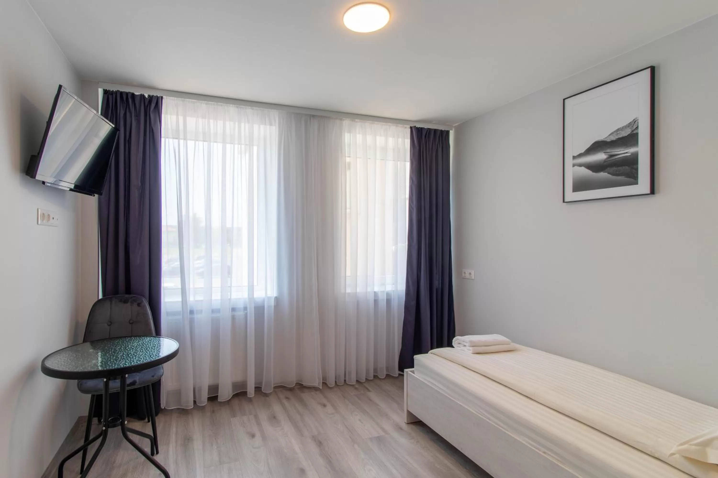 Bed in Dzukija Hotel