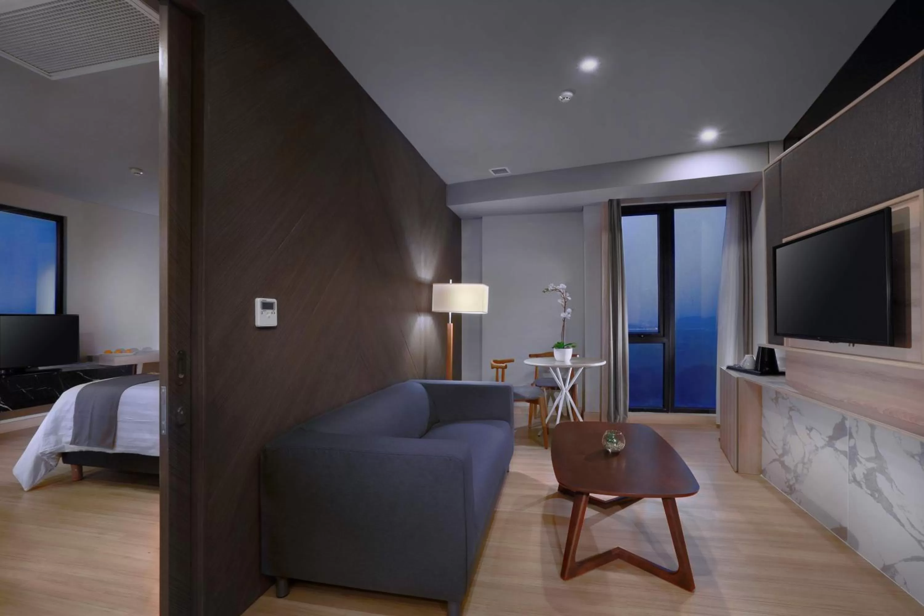 Living room, Bed in Harper Cikarang by ASTON