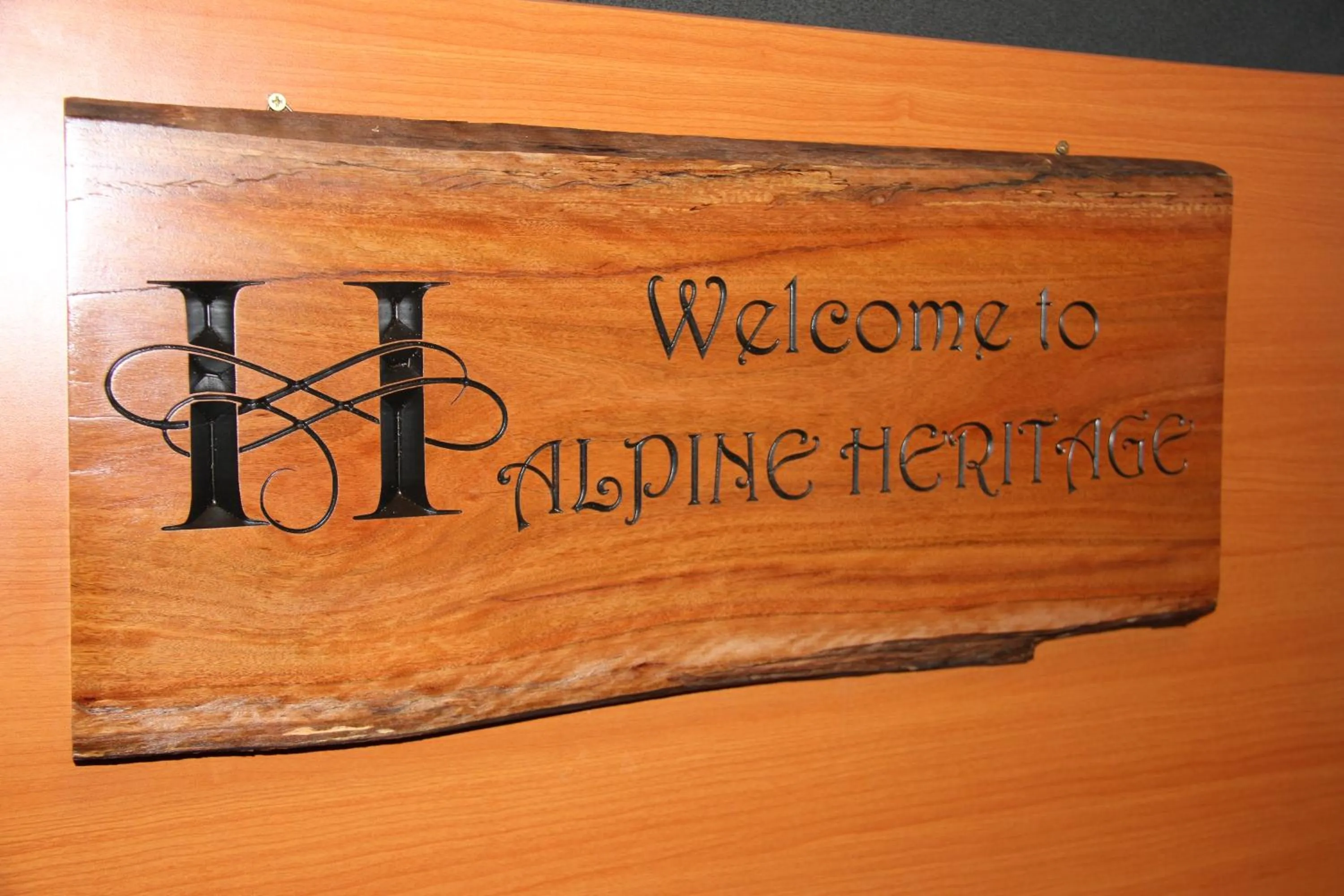 Property logo or sign in Alpine Heritage Motel