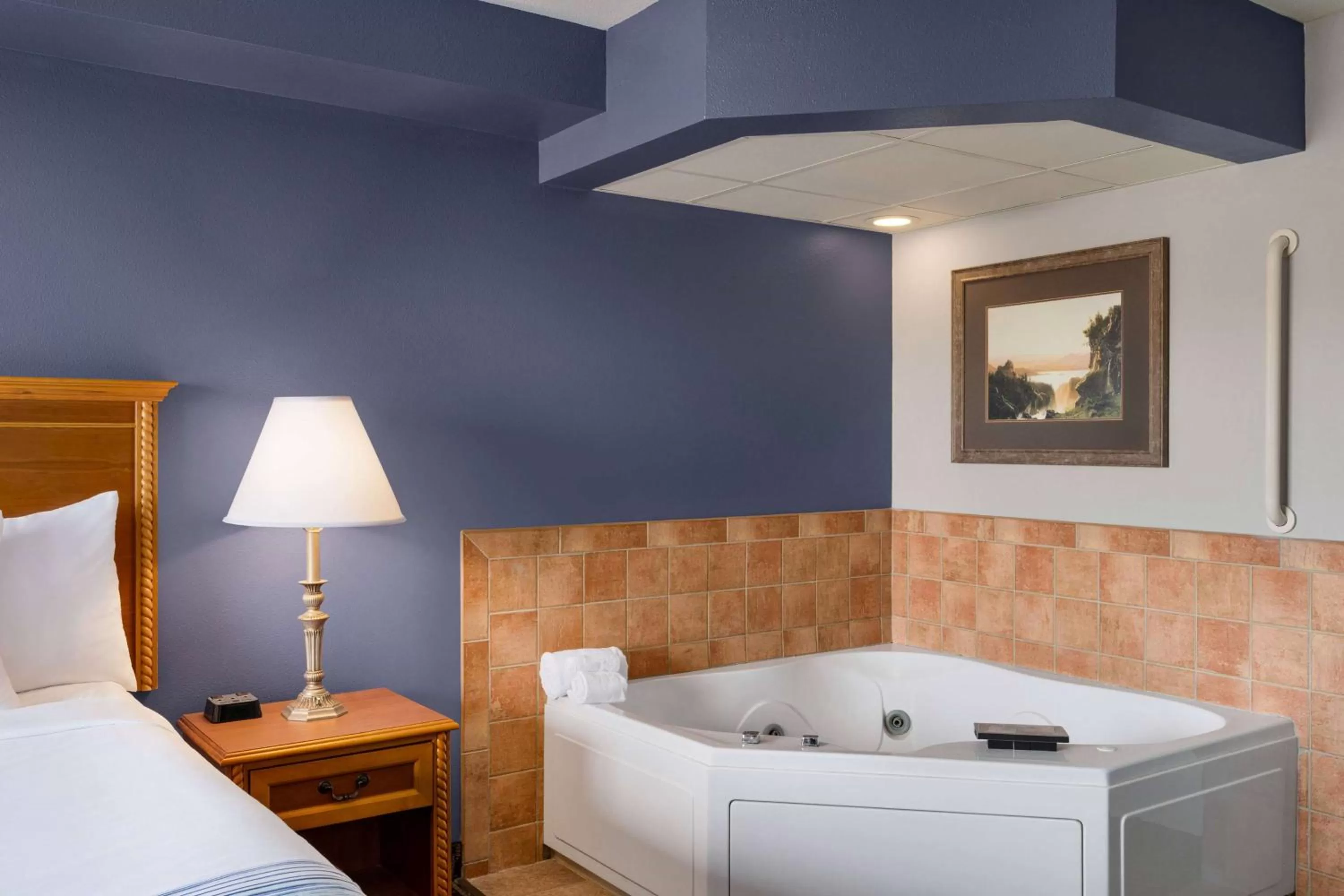 Bed in AmericInn by Wyndham Laramie Near University of Wyoming