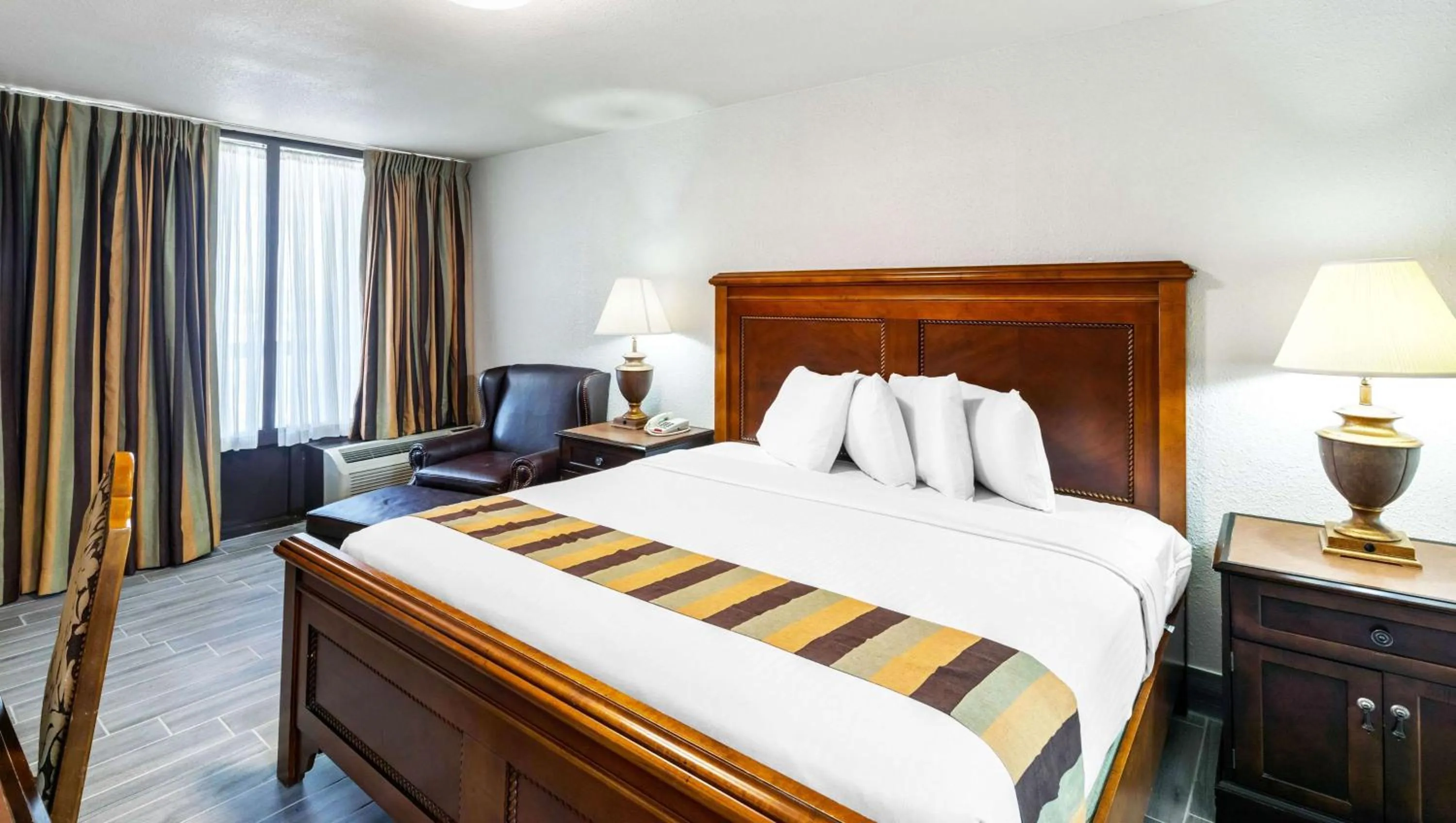 Photo of the whole room, Bed in Magnuson Grand Hotel and Conference Center Tyler