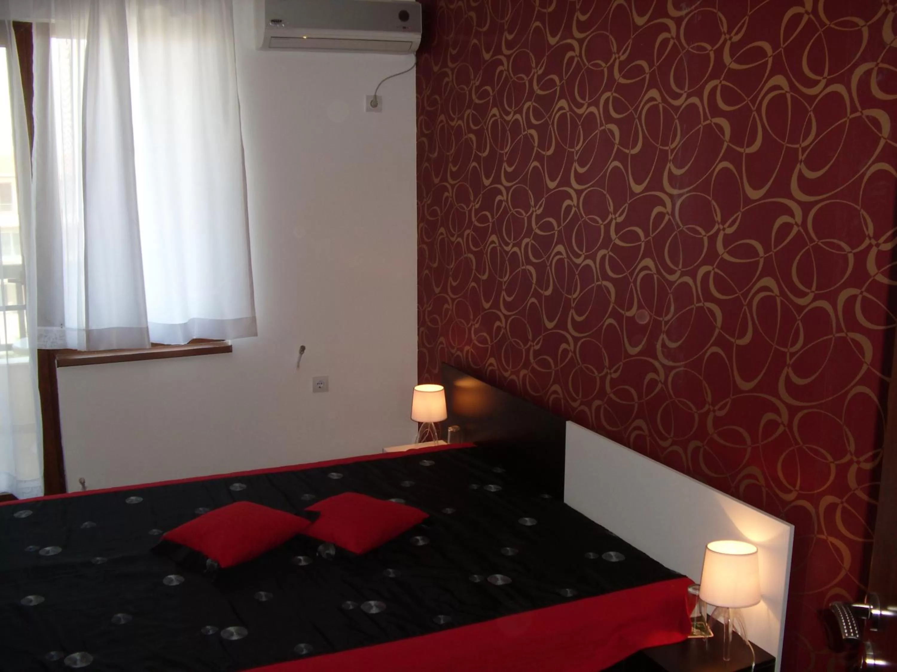 Bed in Family Hotel Malibu