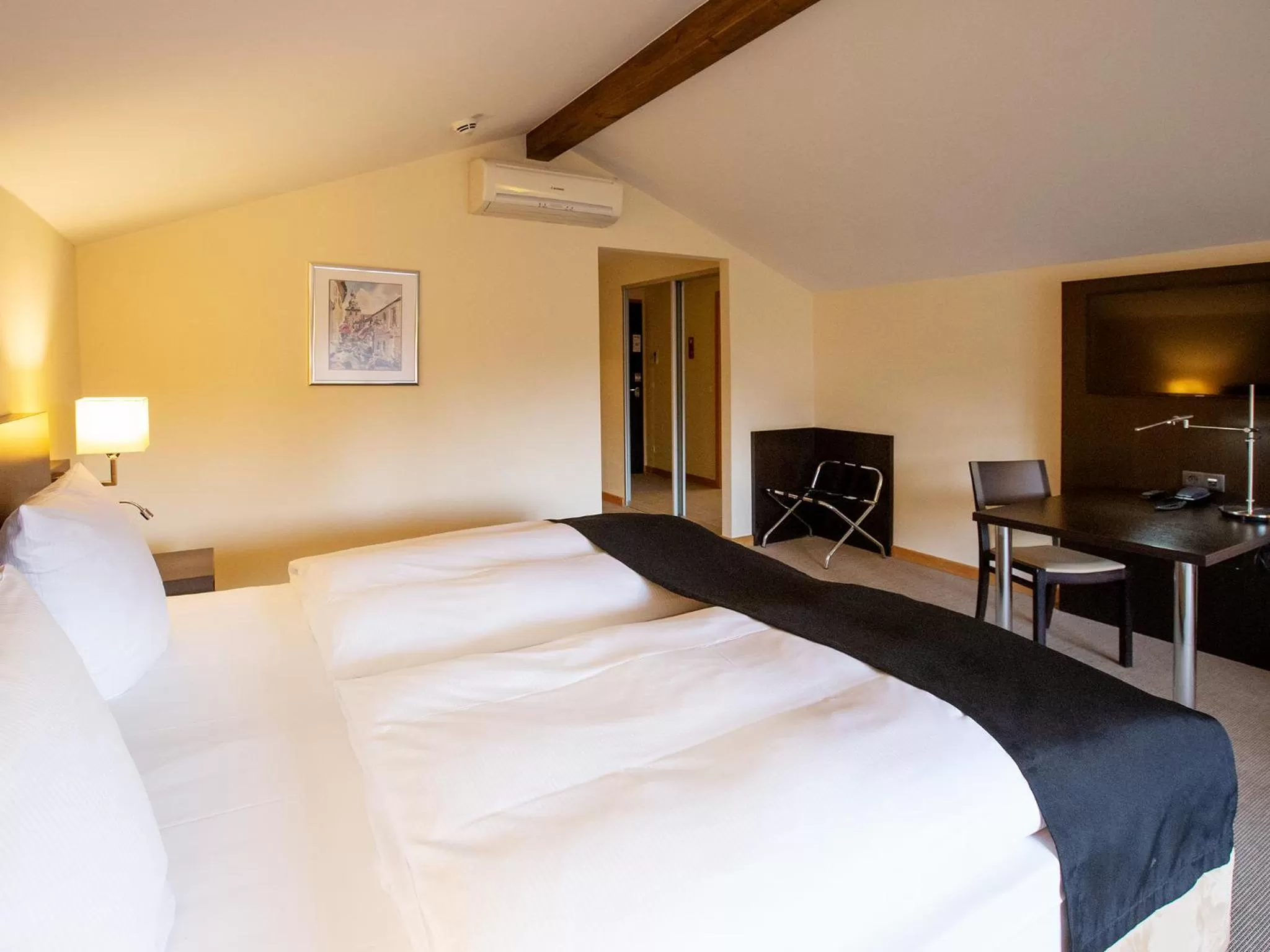 Photo of the whole room, Bed in DORMERO Hotel Altes Kaufhaus Lüneburg