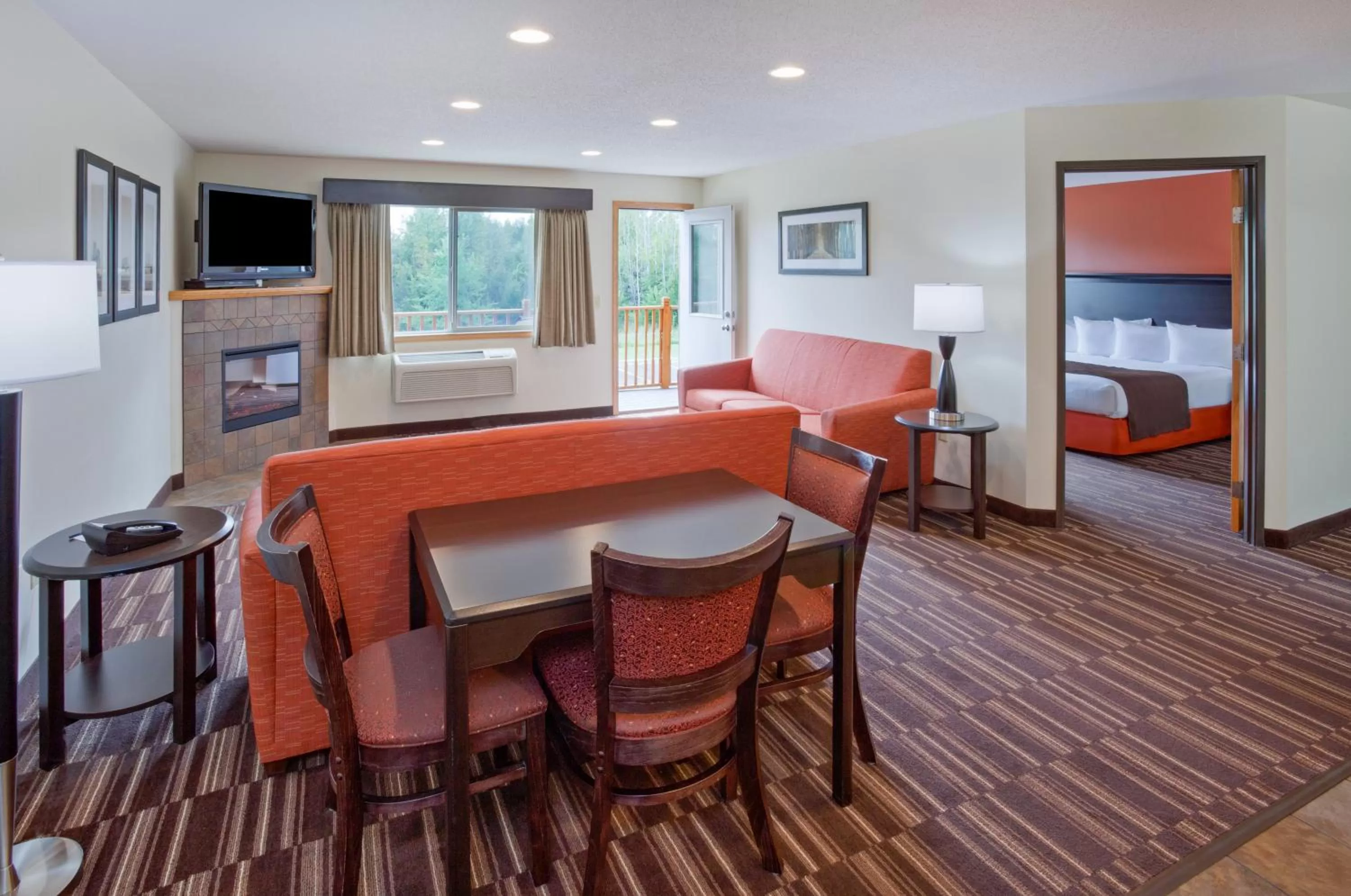 Living room in AmericInn by Wyndham Sartell