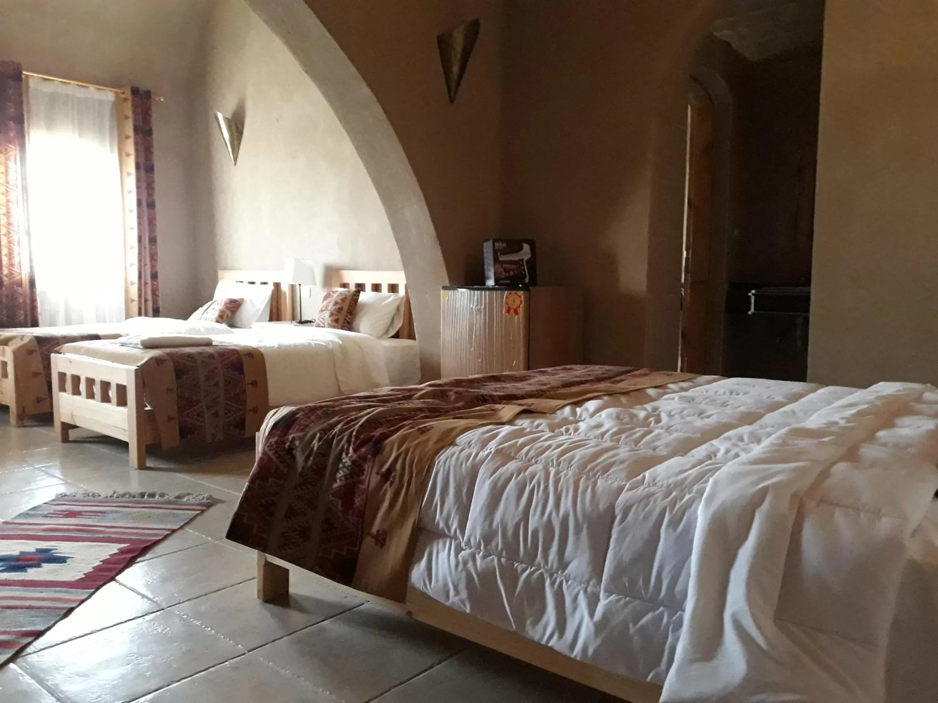 Bed in Embrace Hotel