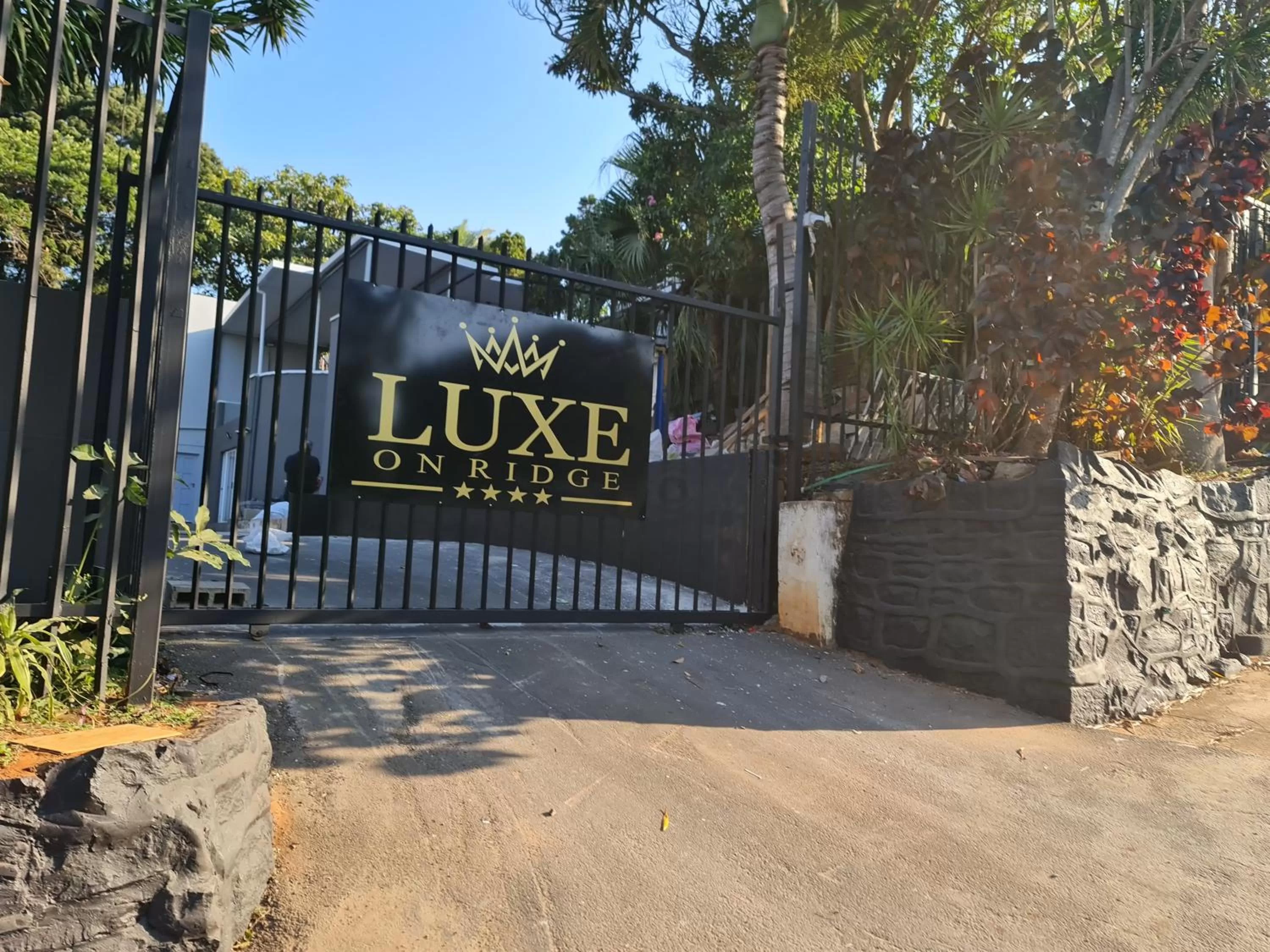Property logo or sign in Luxe on Ridge Boutique Hotel