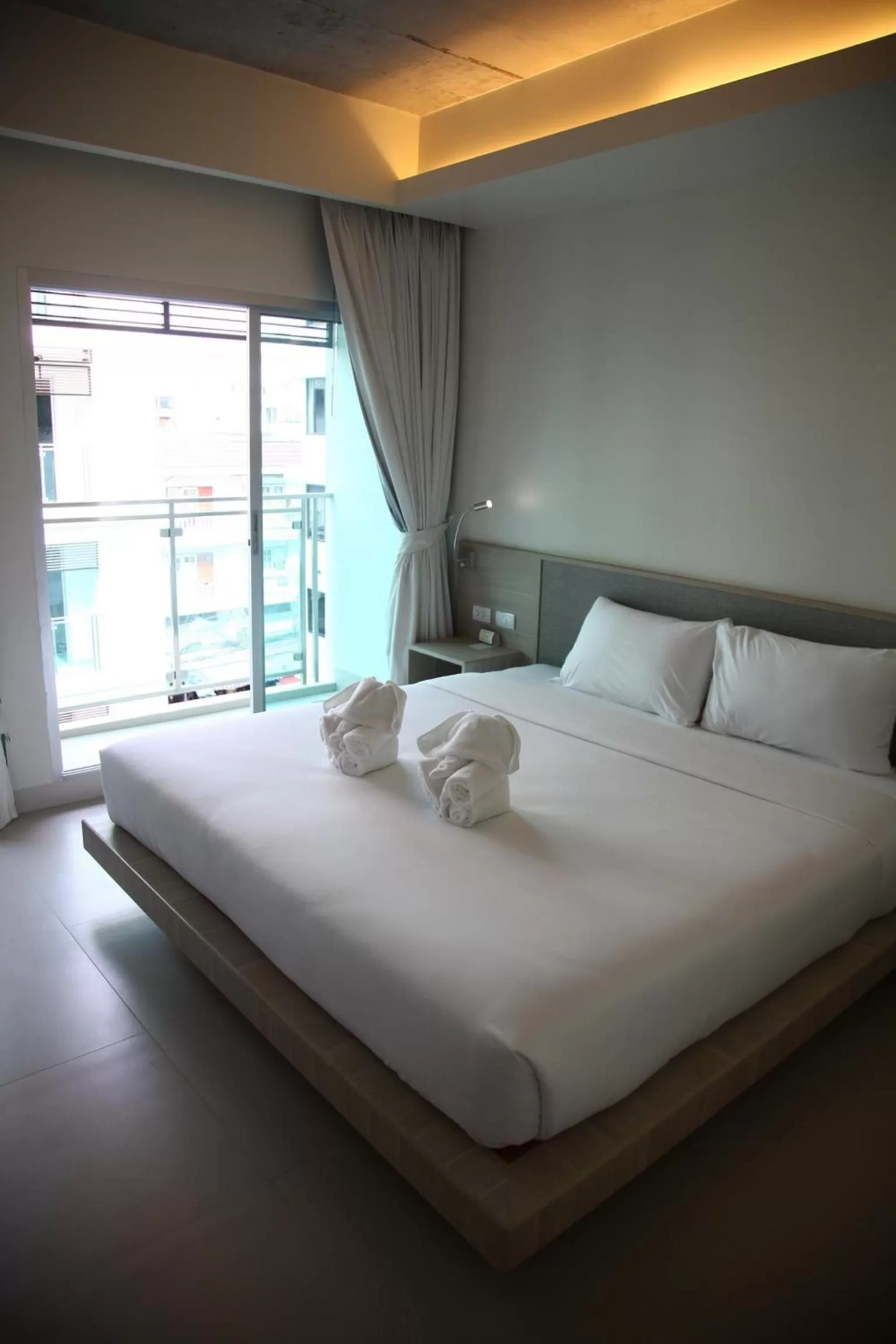 Bed in Sunshine Hotel & Residences