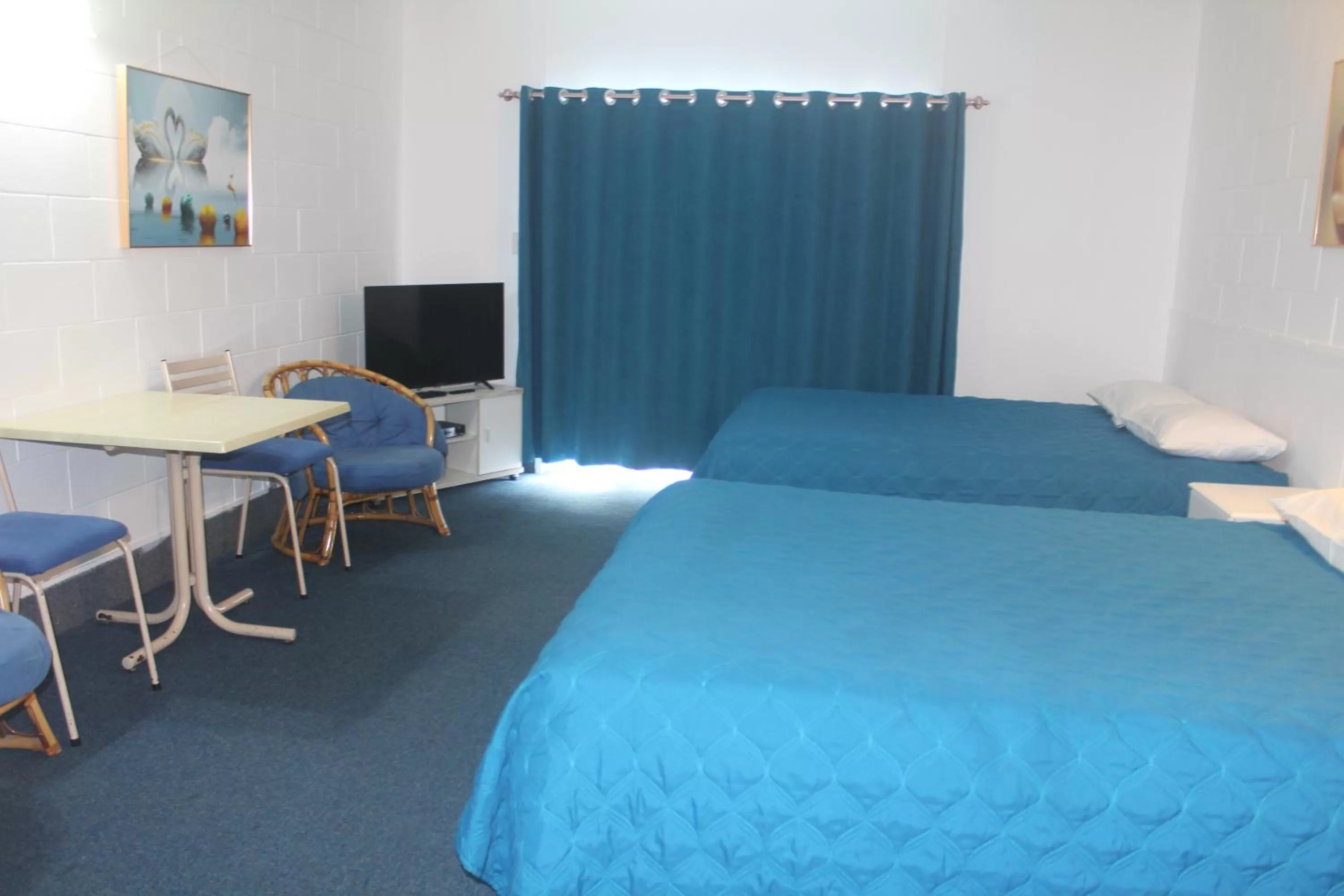 Bed in Golden Glow Motel