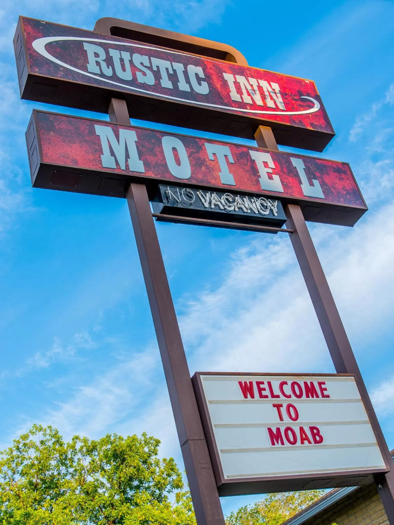 Property logo or sign in Rustic Inn