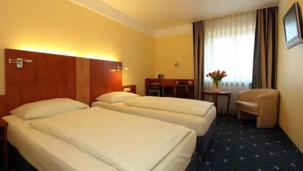 Bed in Aparthotel Astro - Nichtraucherhotel