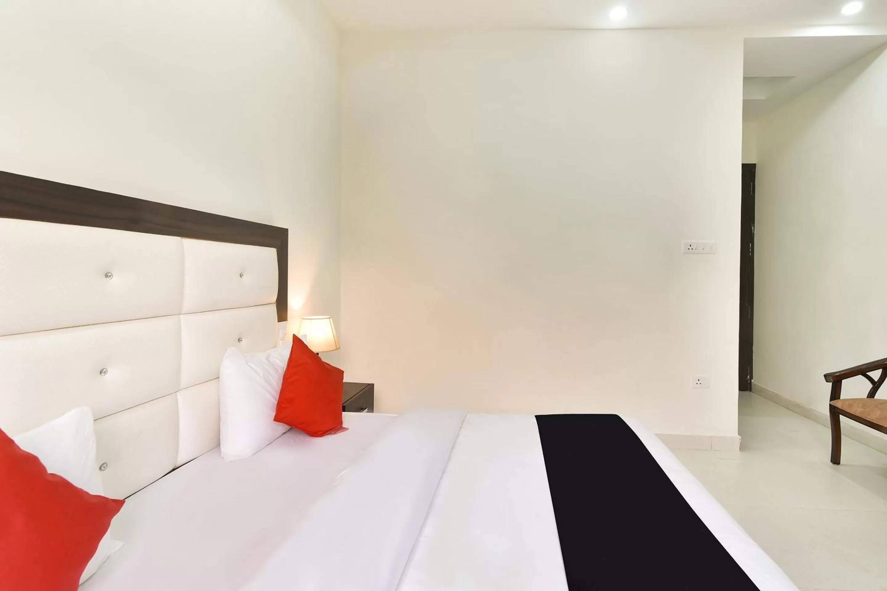 Bedroom, Bed in Capital O Yogasthali Inn Hotel And Spa