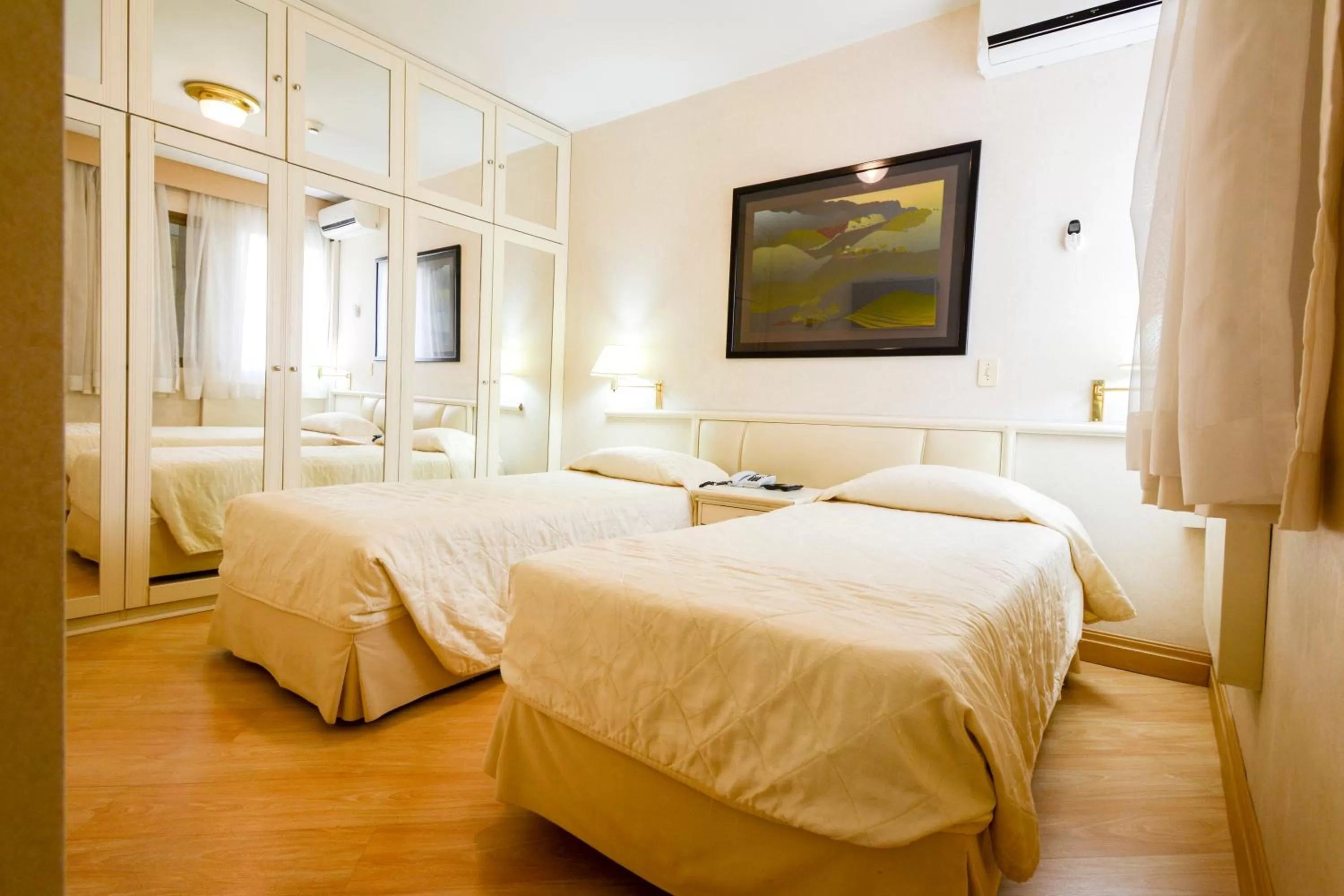 Bed in Wall Street Apartments by BnbHost