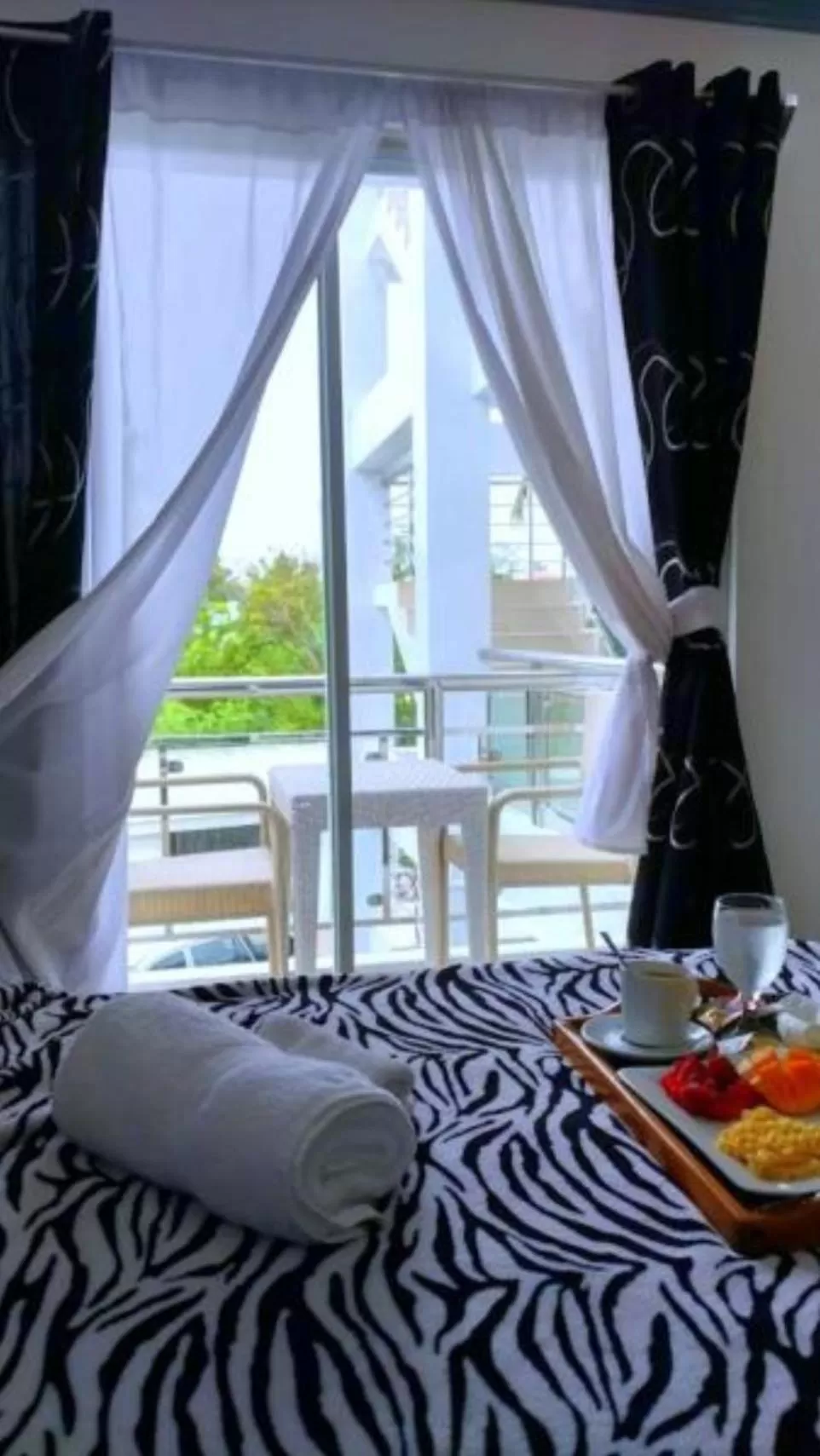 Balcony/Terrace, Bed in Bohol South Beach Hotel