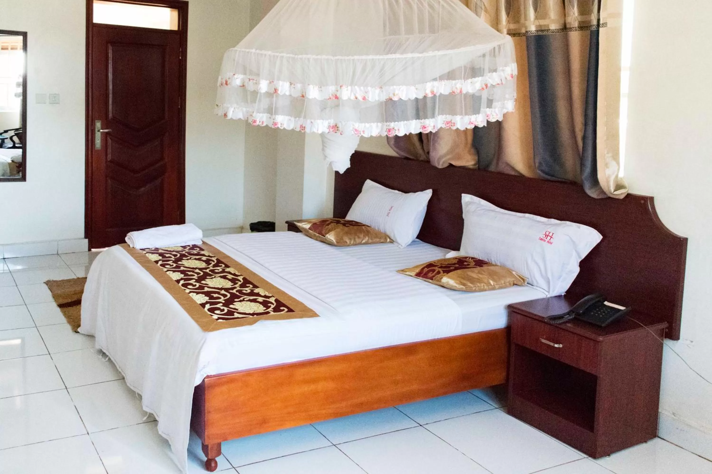 Bed in Sunrise Hotel Kampala